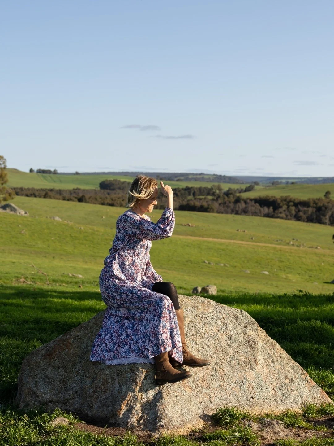From this rock, Emilie can see a little bit of everything&hellip; the hills rolling in the distance, sheep grazing in the paddocks, and sometimes even a wedding ceremony unfolding.

What do you think Em was watching?
A) Sheep grazing in the field
B) 