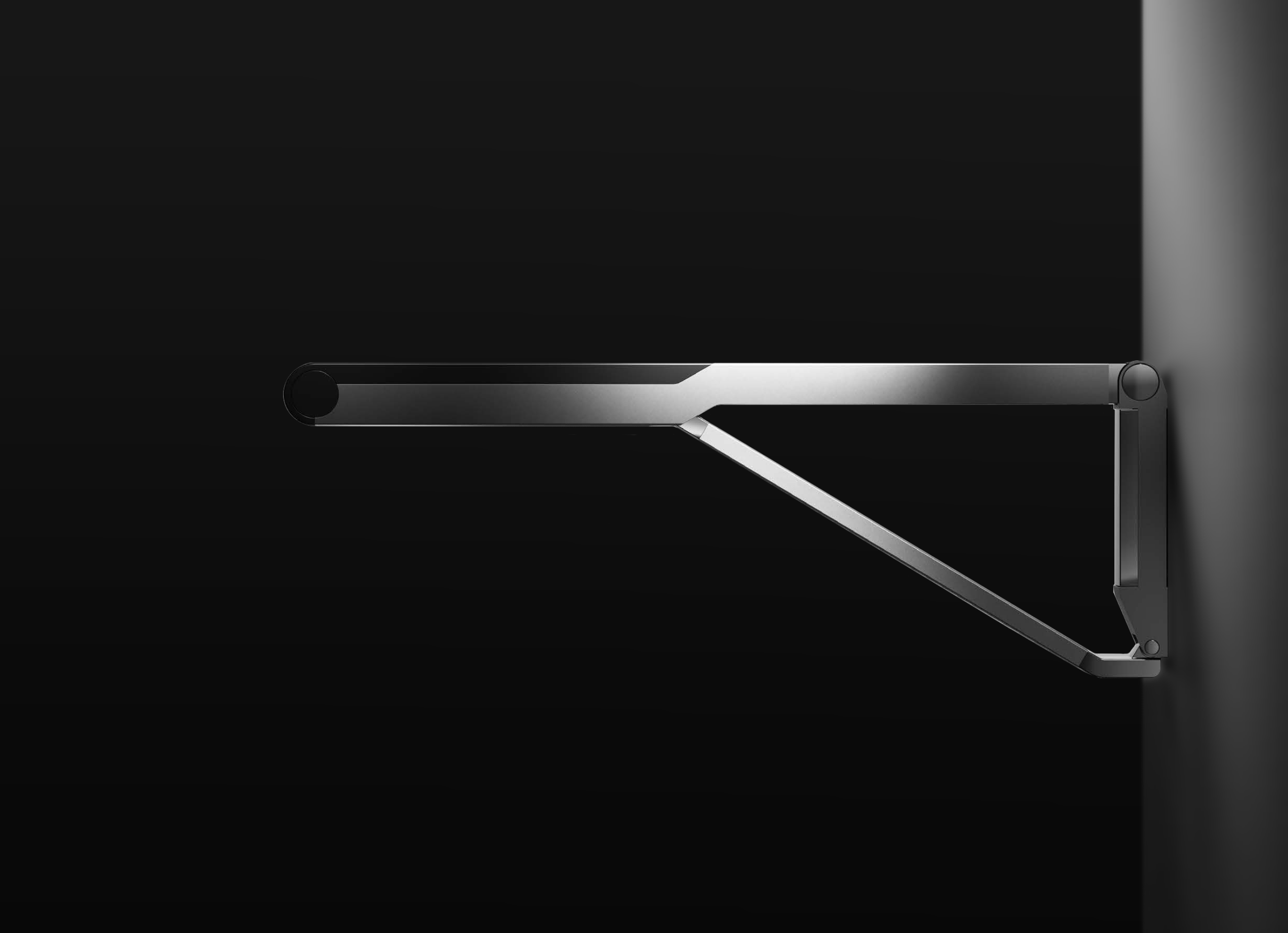 Axess drop down supporting rail by Keuco, designed by Kai Rump and Studio F. A. Porsche mounted on a wall with a black background.