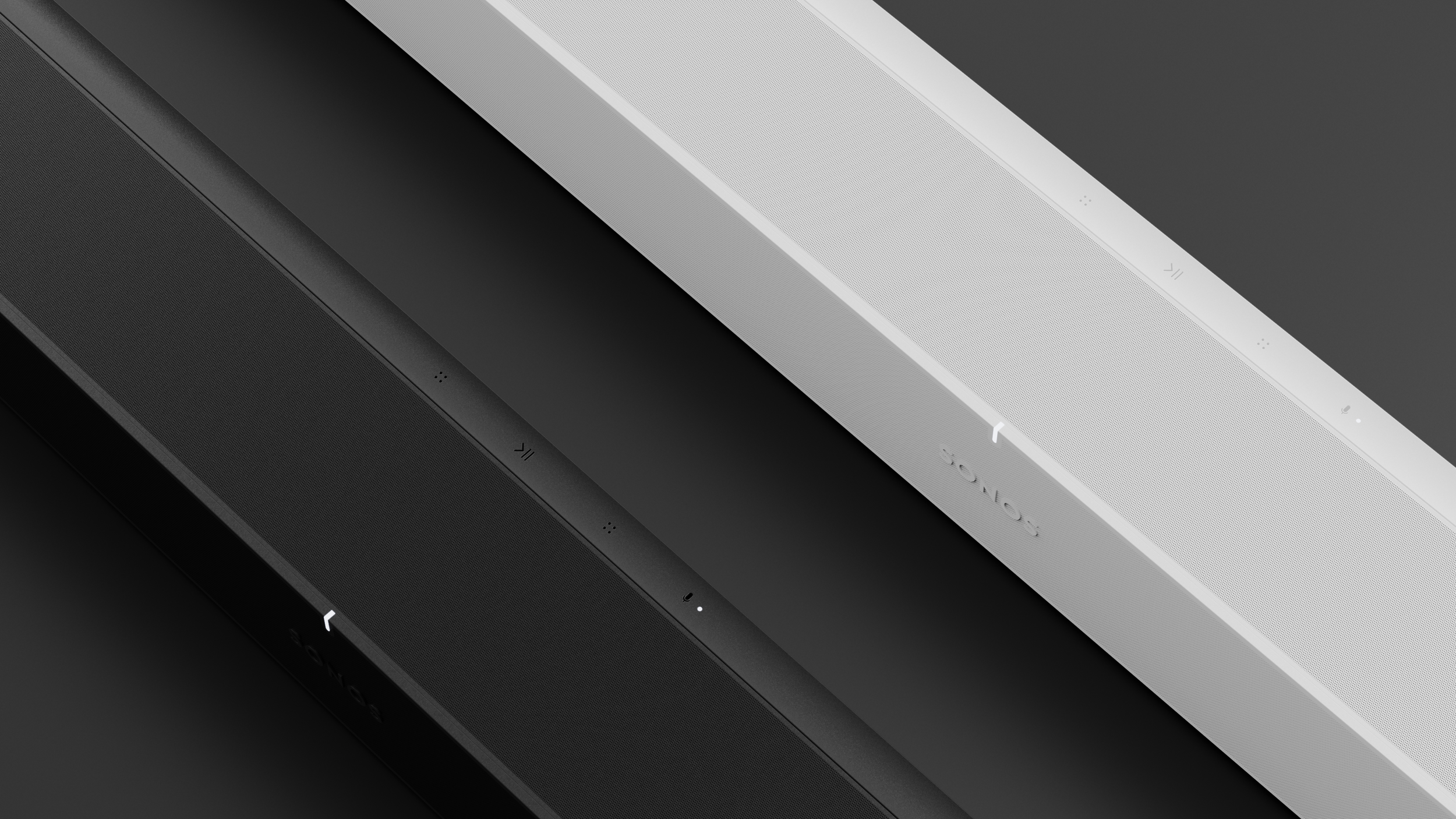 Arc by Sonos non-commercial student concept by Kai Rump, black and white variants, close-up shown on dark ground surface.
