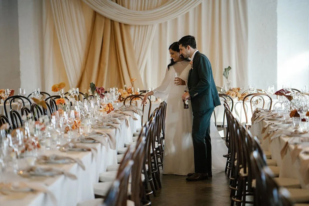 Bride and groom checking their wedding set up at the Trinity Buoy Wharf in London