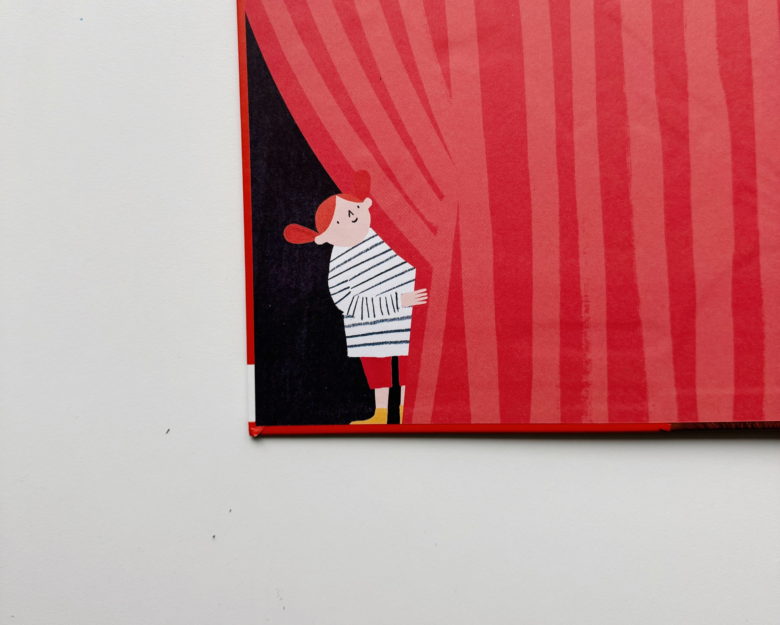 A cartoon illustration of a girl with red hair, wearing a striped shirt, peeking from behind a large red curtain with vertical stripes.