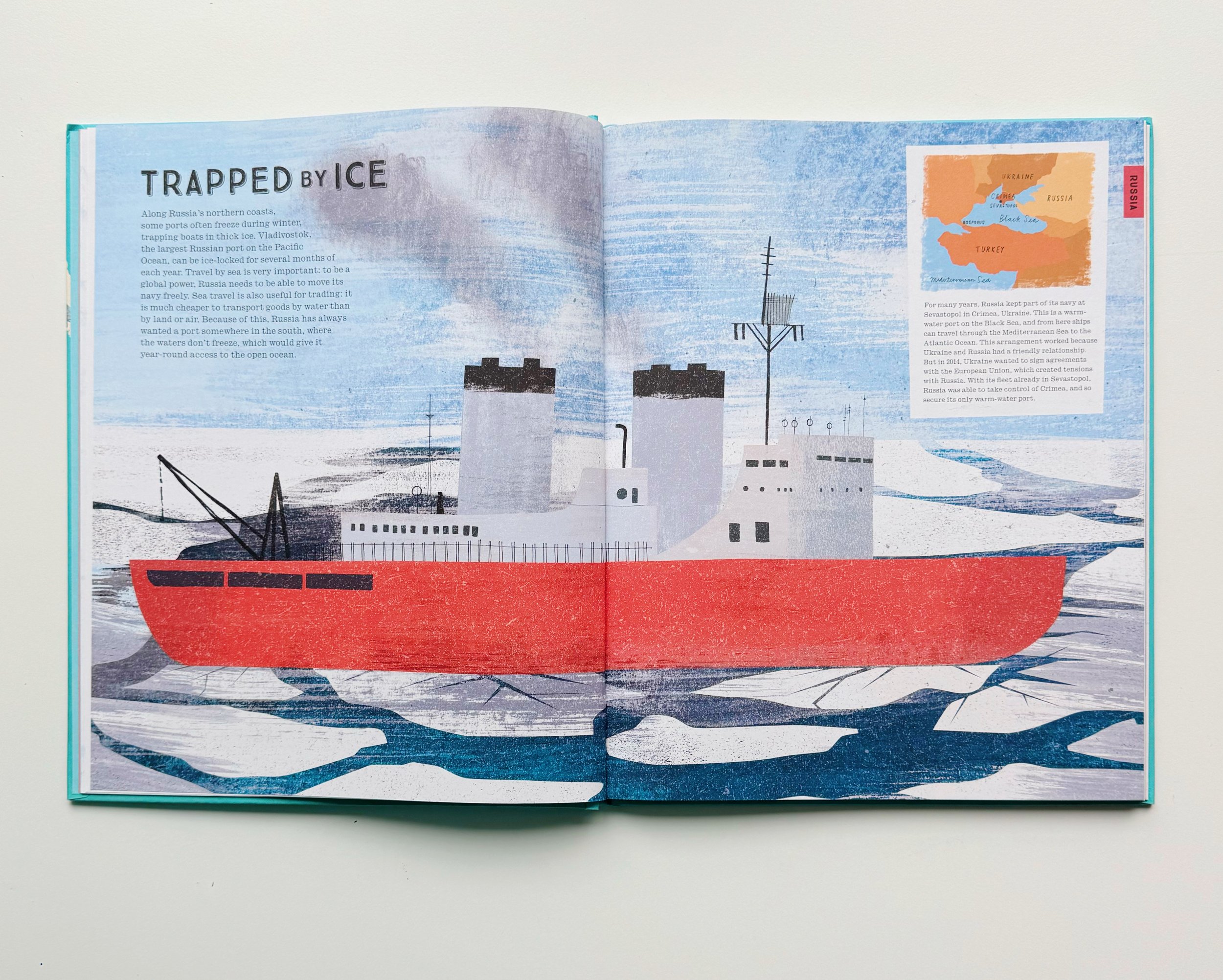 Open book with illustration of a ship trapped in ice and a map of Crimea in Ukraine.