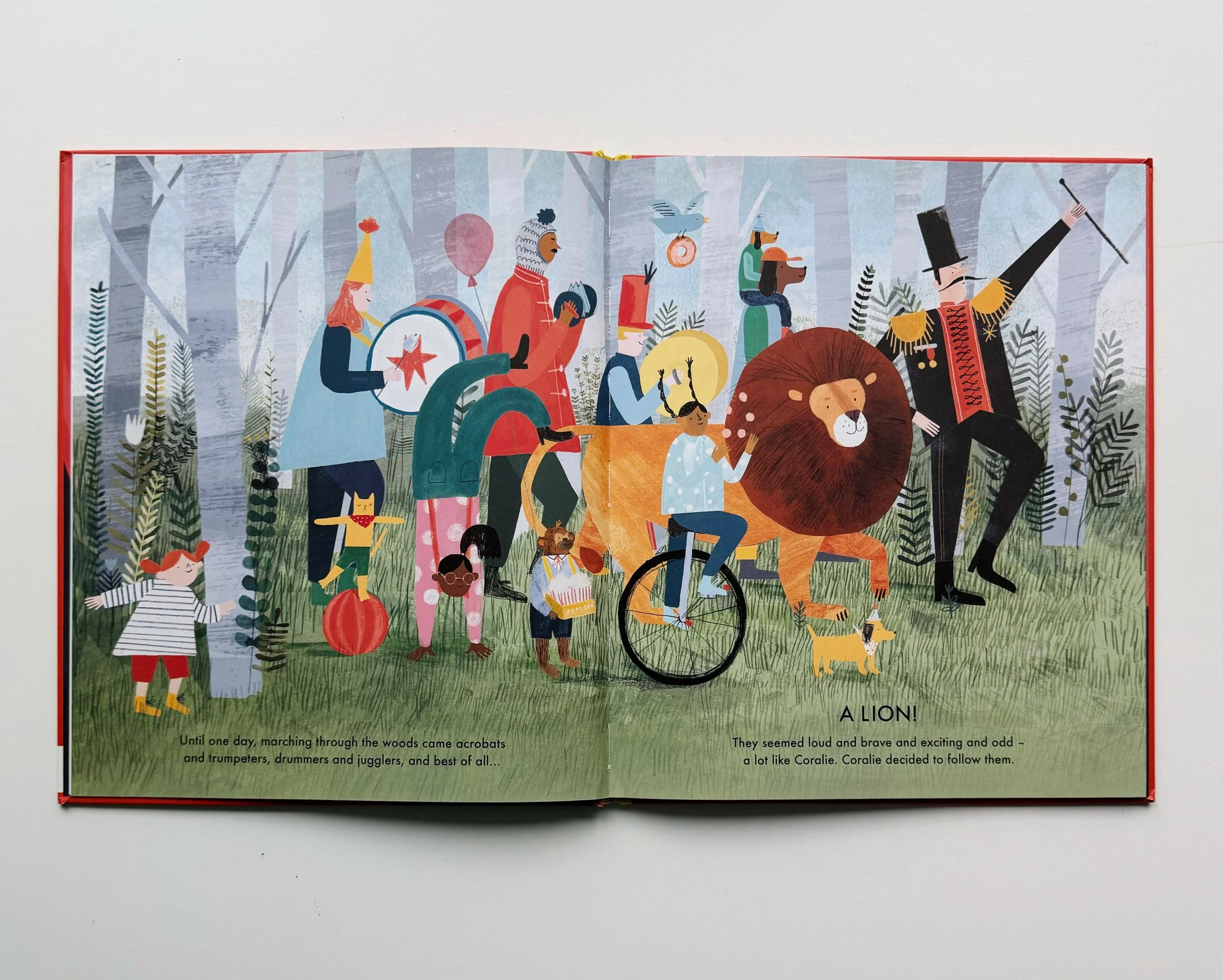 Illustration of a parade through a forest with performers dressed as carnival characters, including a lion, a drum player, a person riding a bicycle, and a man in a tall hat leading the parade. The scene depicts a whimsical, colorful procession.