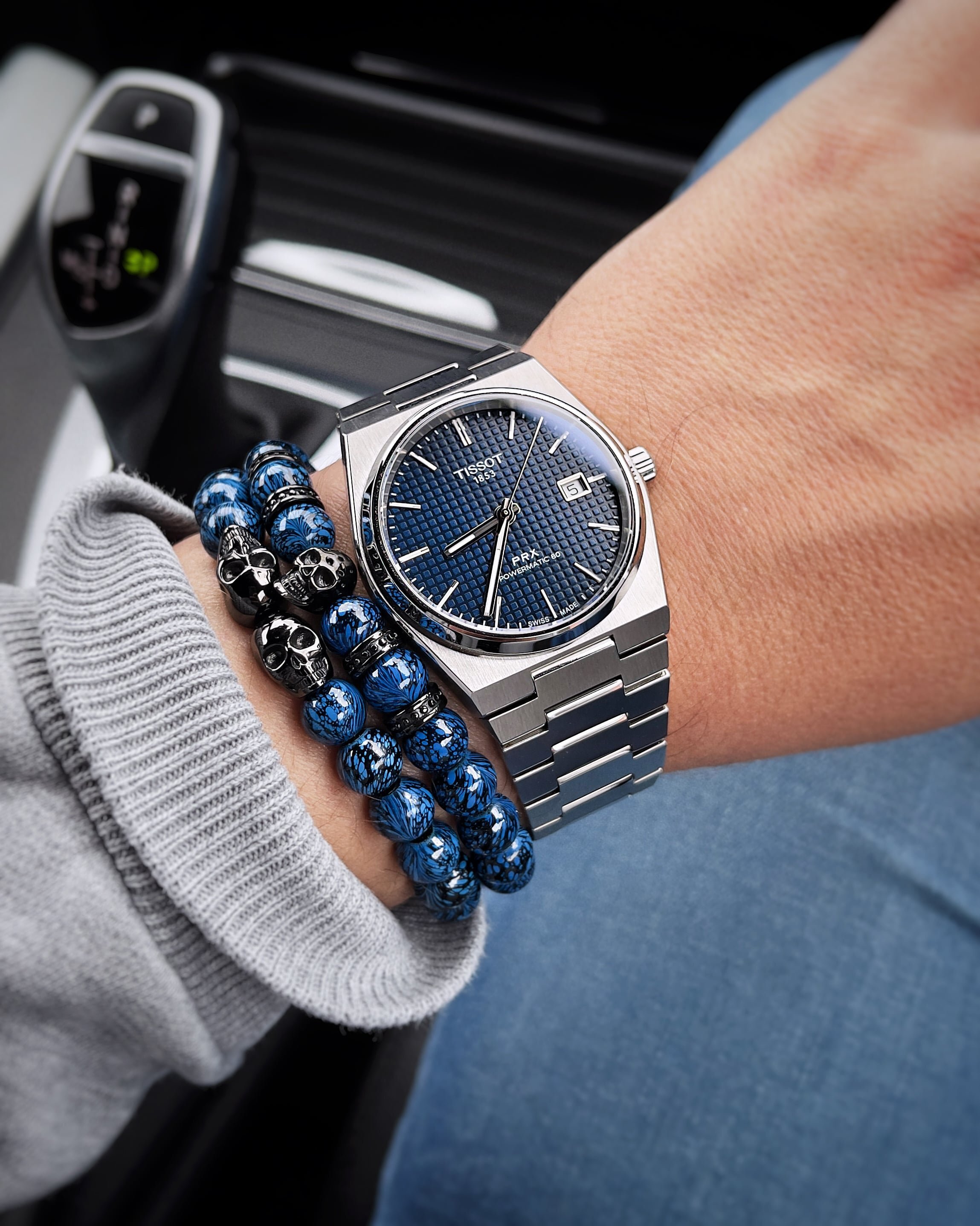 Tissot PRX Powermatic 80 blue waffle dial on the wrist with stainless steel bracelet
