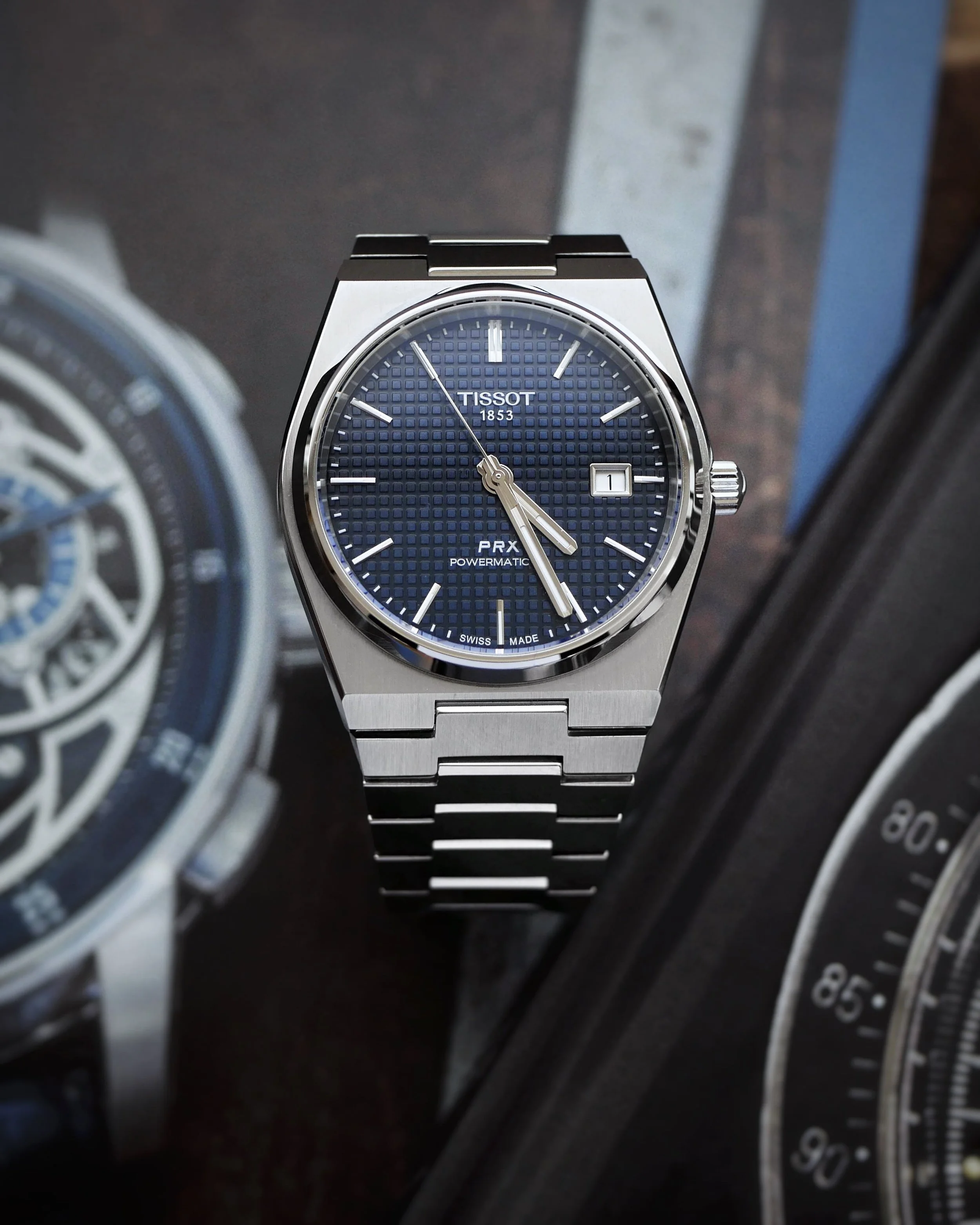 Front view of the Tissot PRX Powermatic 80 showing its textured blue waffle dial