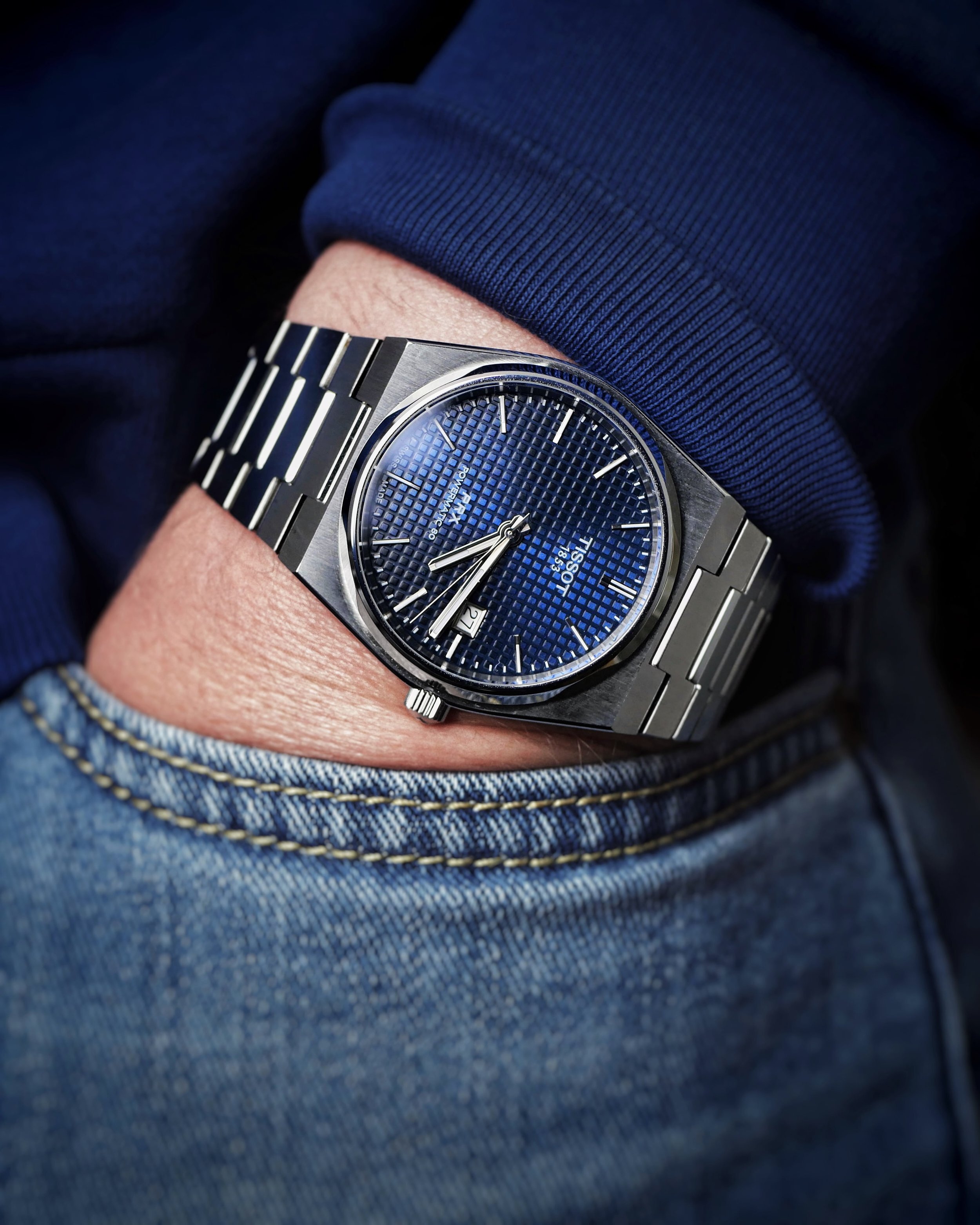 Tissot PRX Powermatic 80 blue dial on the wrist showing the integrated bracelet fit