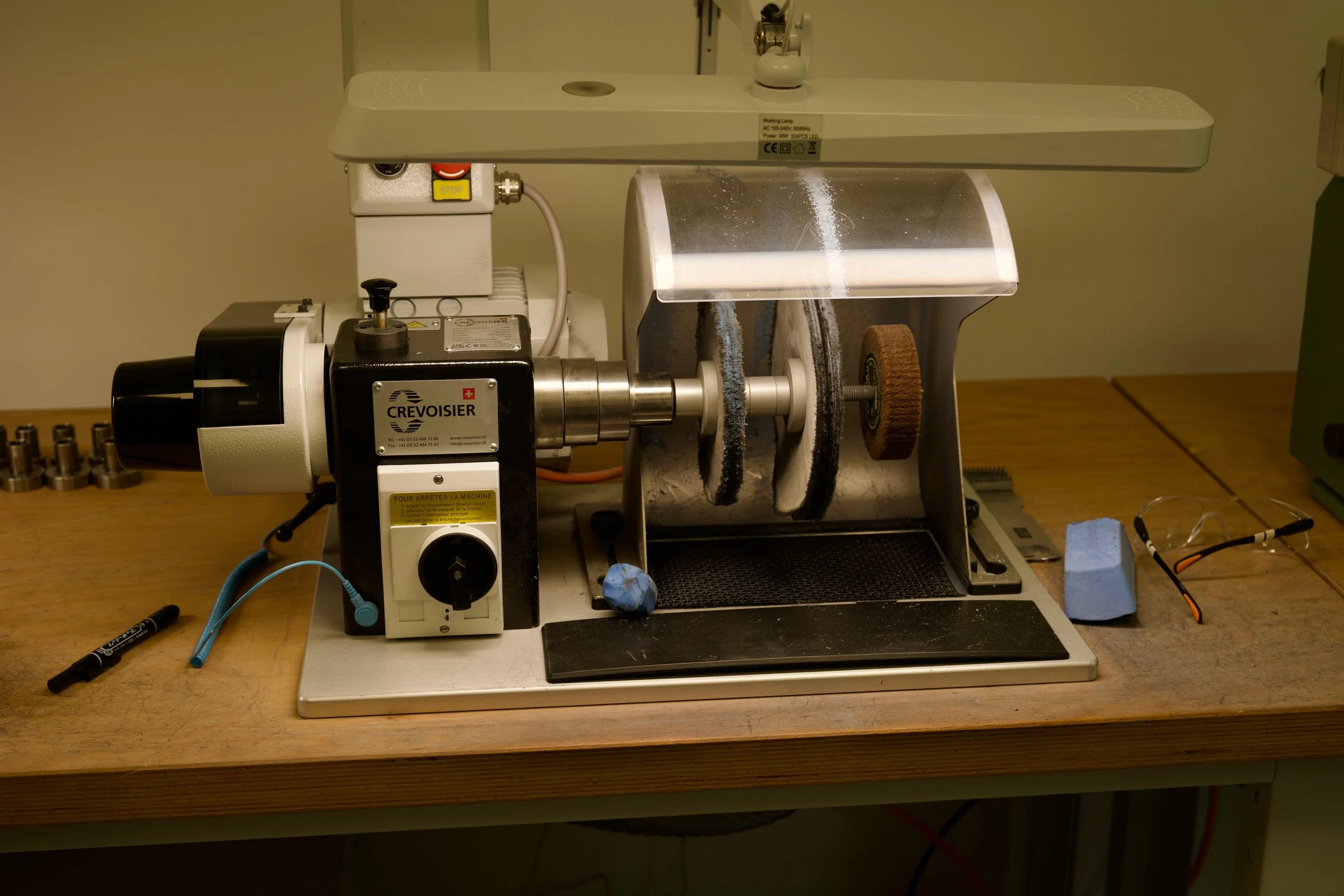 Polishing machine used for watch case refinishing inside the Seiko UK workshop.