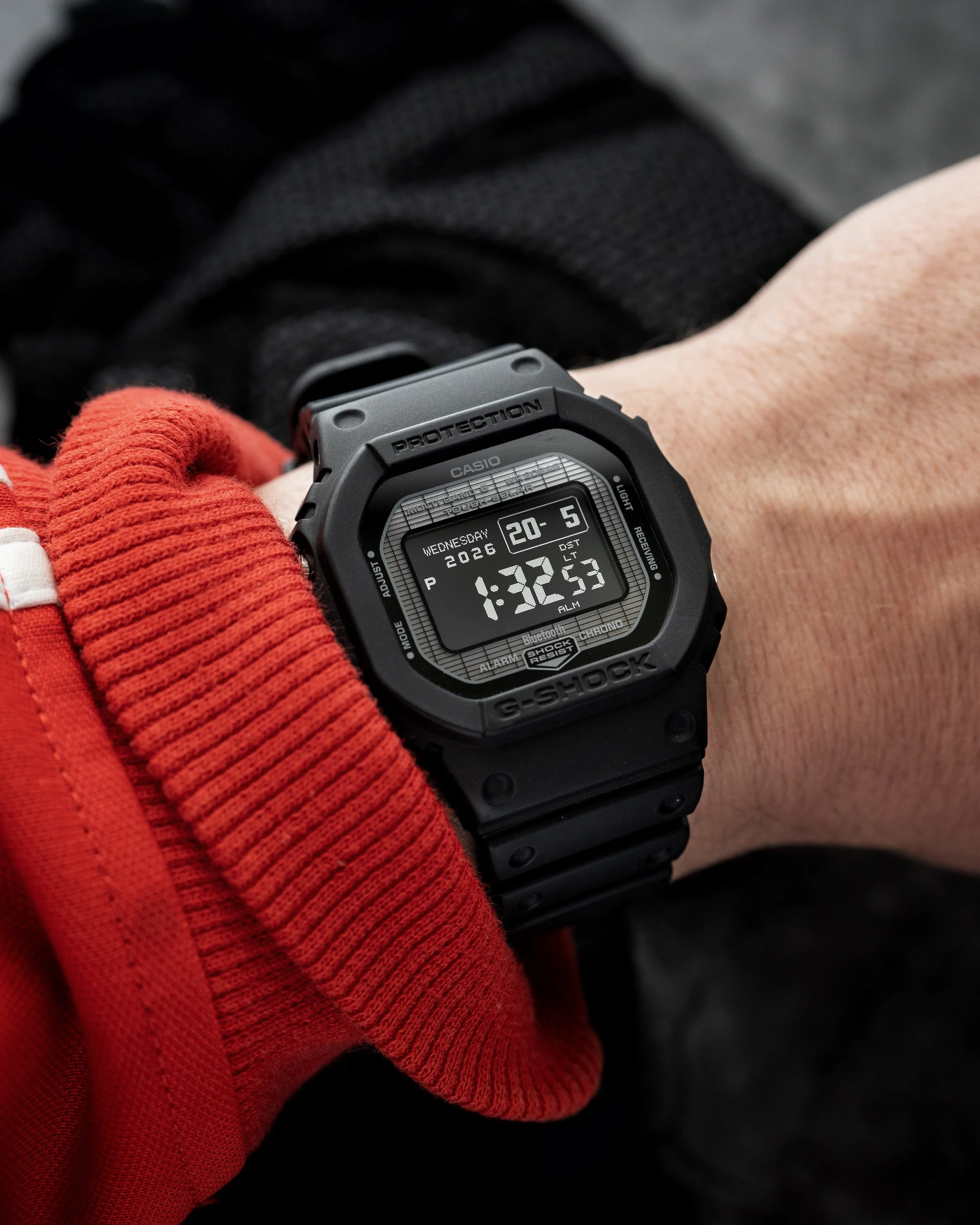 G-SHOCK GW-BX5600-1A1 on wrist showing the black resin square case and clear negative MIP display