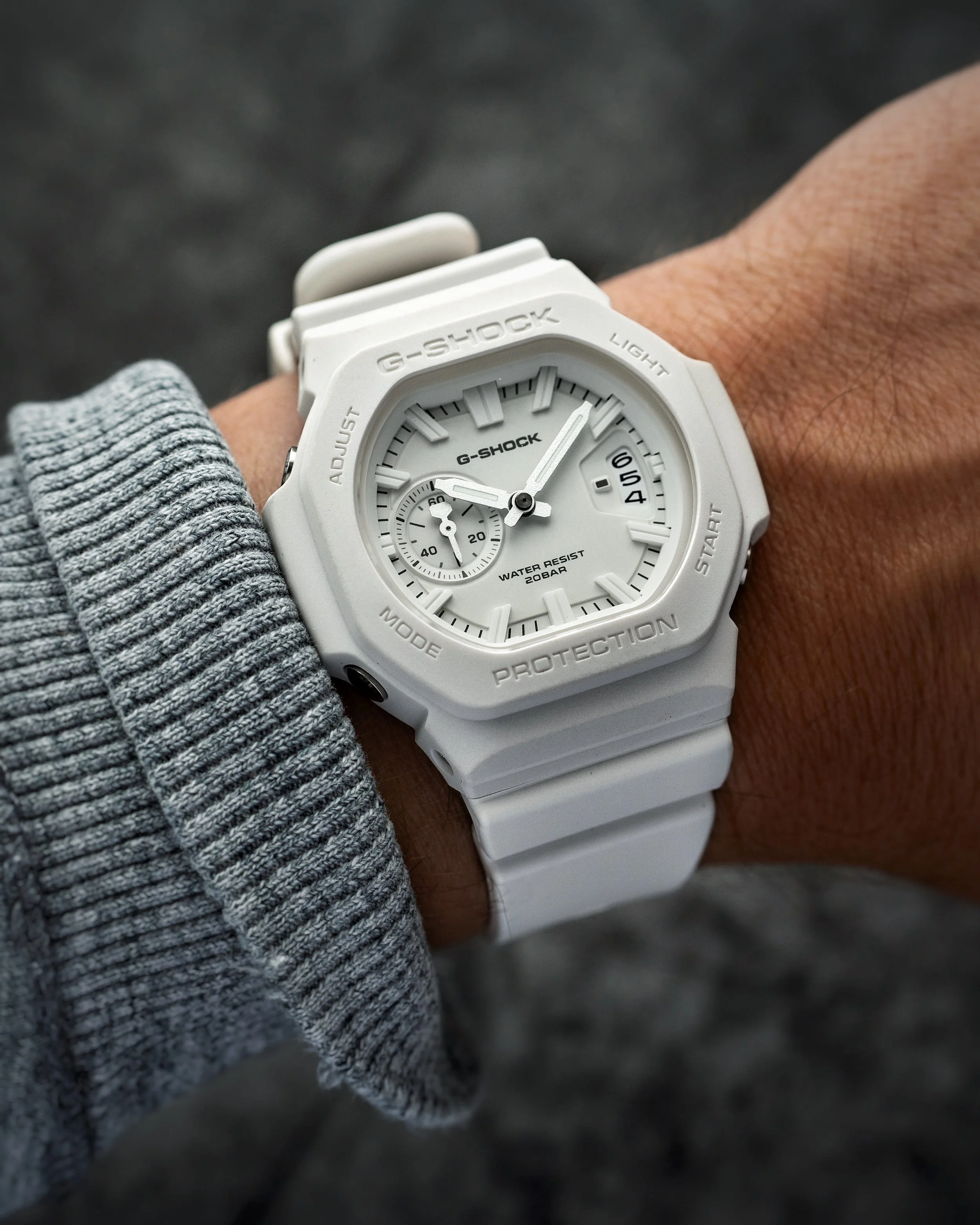 White Casio G-SHOCK GAC-2500-7A CasioNaut worn on the wrist, showing its white resin case and strap, matching analogue dial, raised hour markers and date display.   Copy