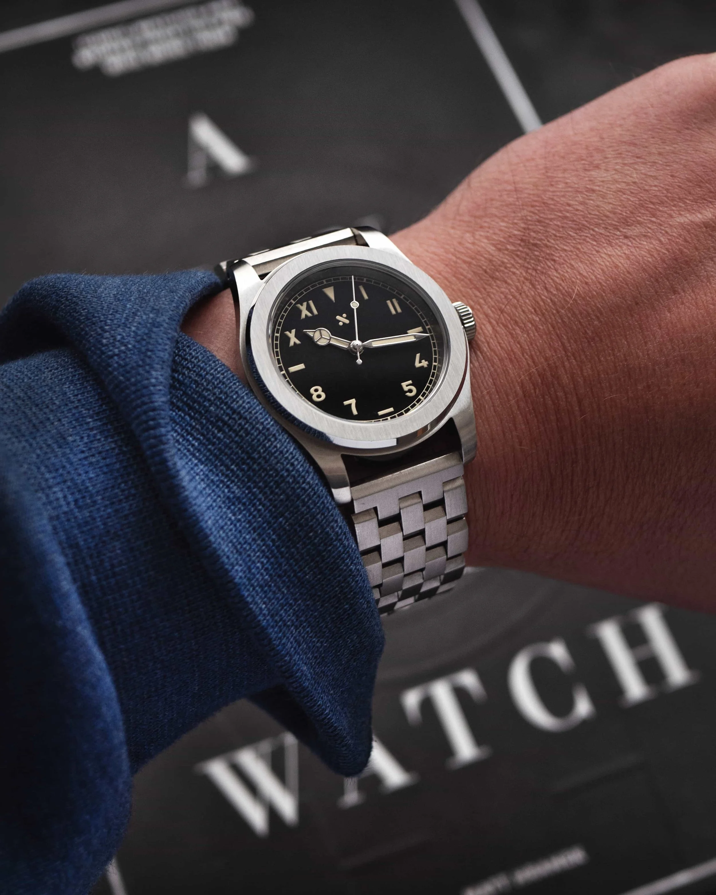 Namoki NMK931 California-dial watch worn on its brushed five-link bracelet