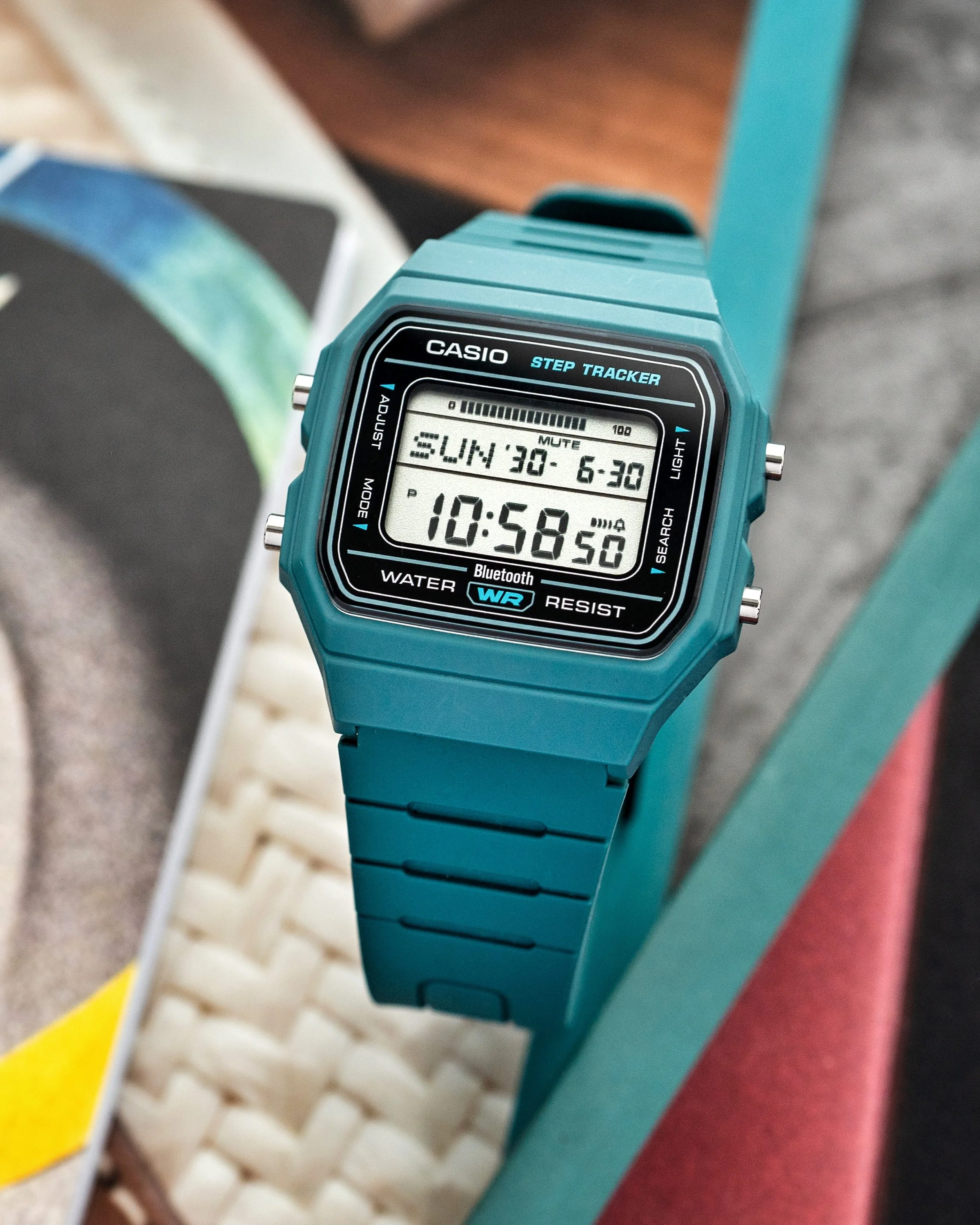 Casio F-B100W-3AJF teal digital watch with Bluetooth and step tracker