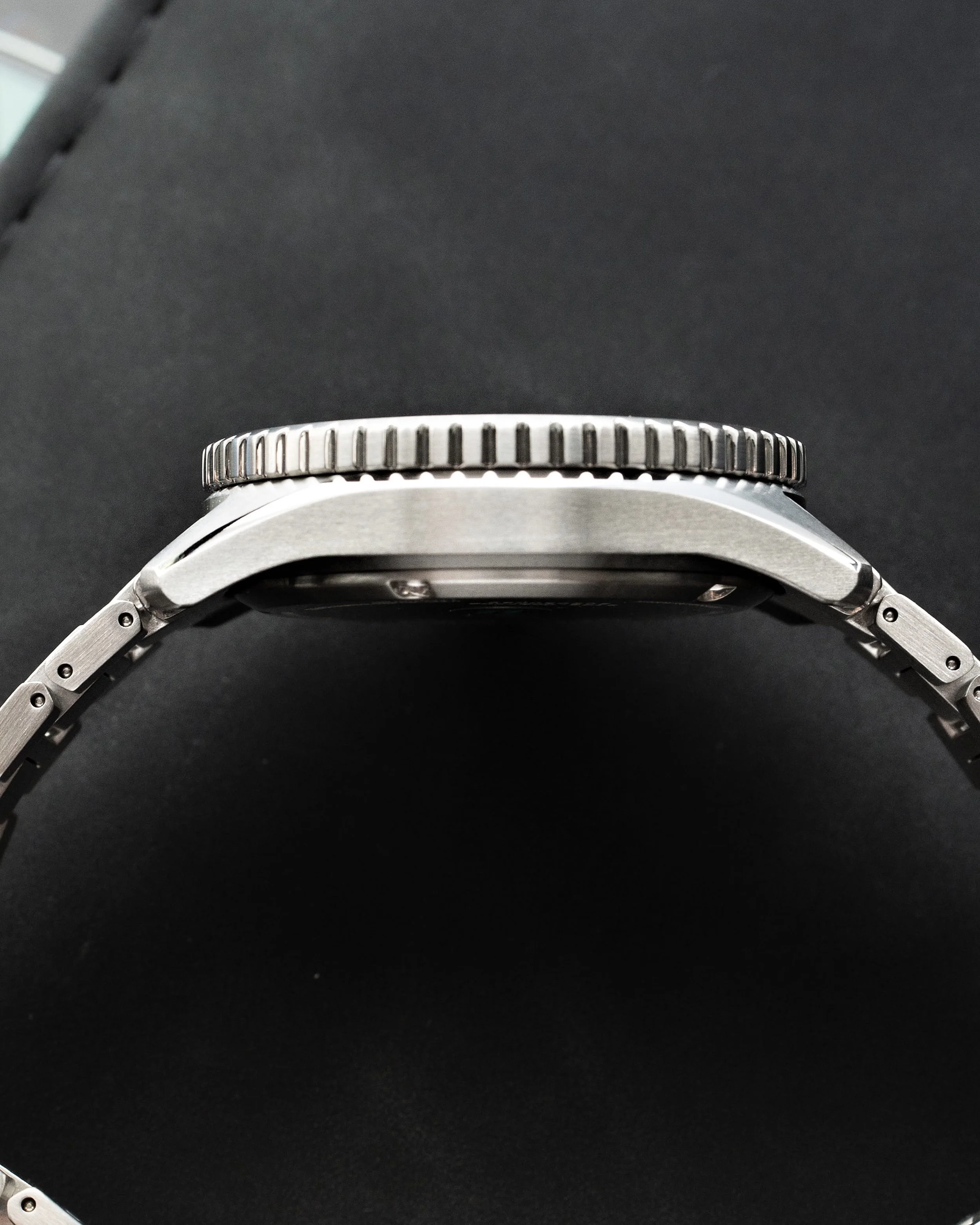 Side profile of the Citizen Promaster BN0260-54L showing the slim case and coin-edge dive bezel.