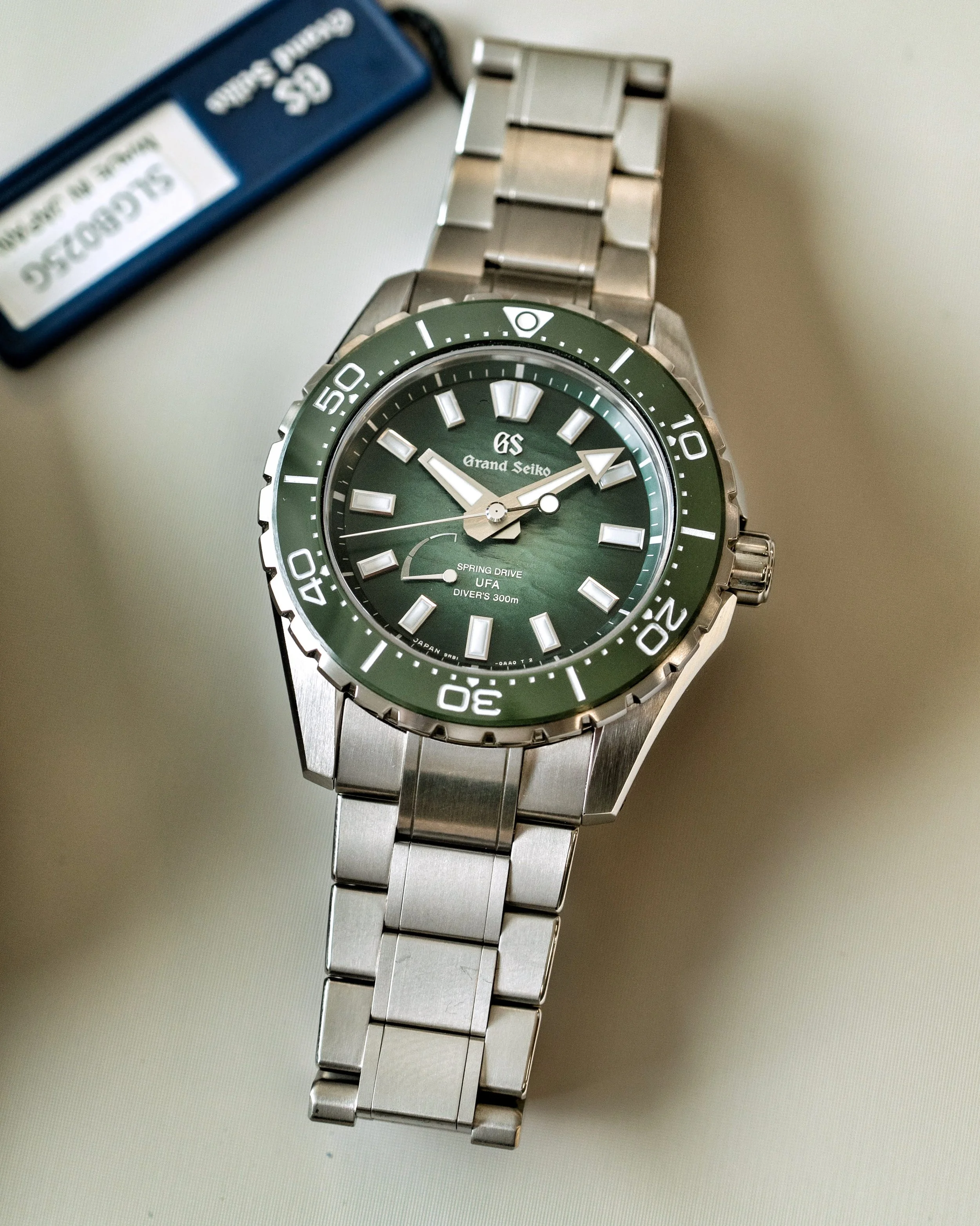 Grand Seiko SLGB025 Ushio 300 Diver with green textured dial and titanium bracelet during a hands-on preview.
