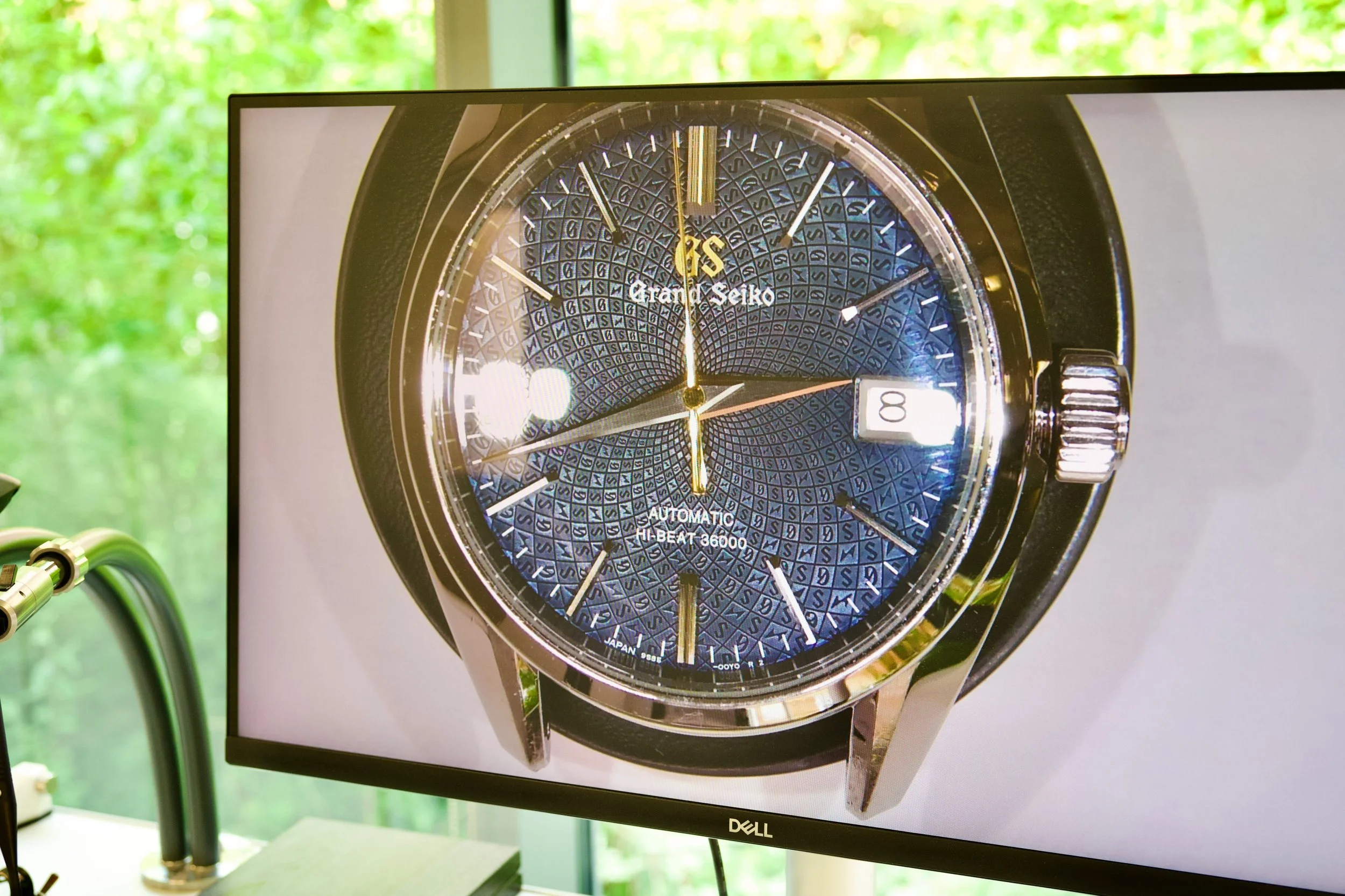 lose-up view of a Grand Seiko dial shown on a monitor inside the Seiko UK workshop.