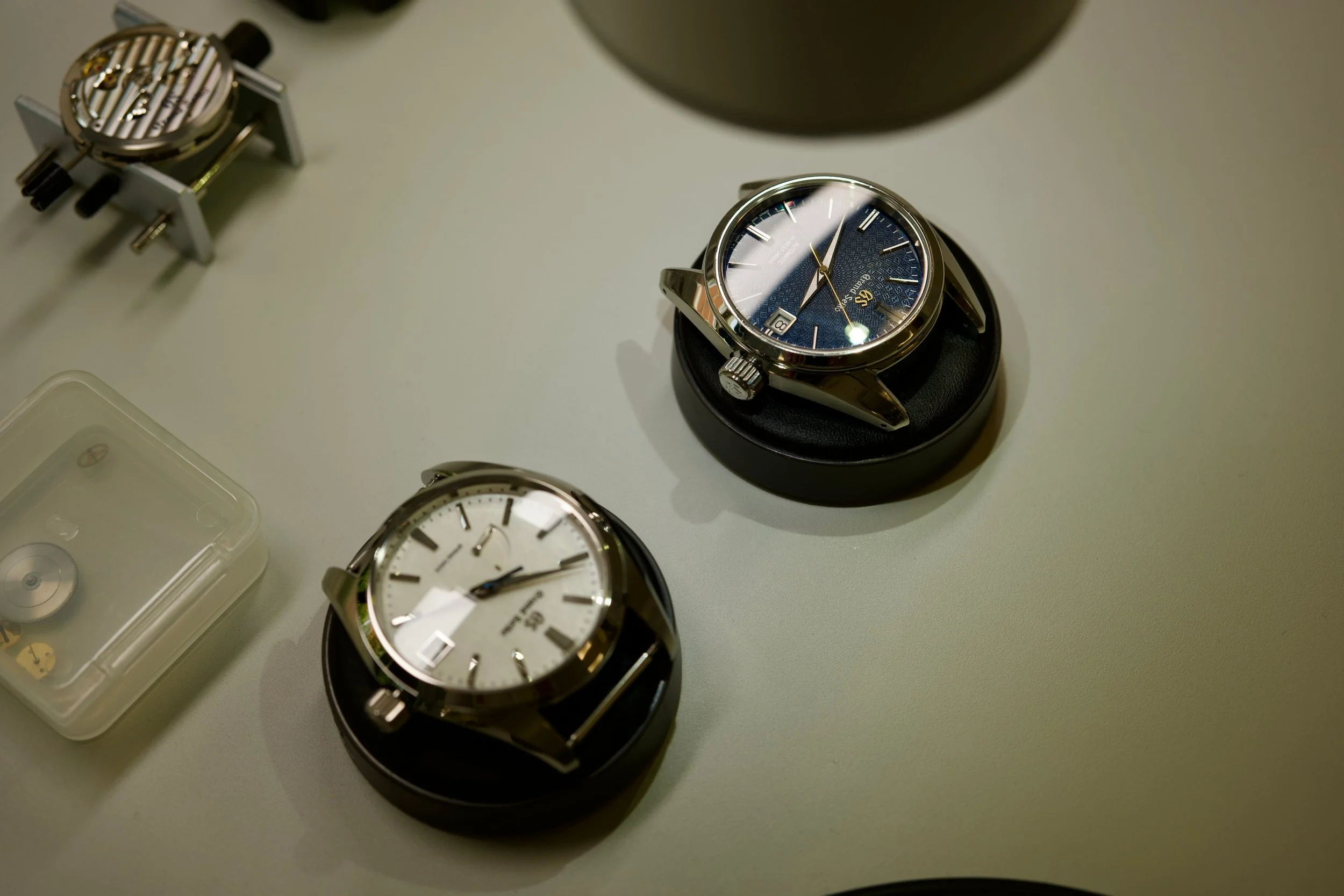 Grand Seiko watches on a bench inside the Seiko UK service centre.