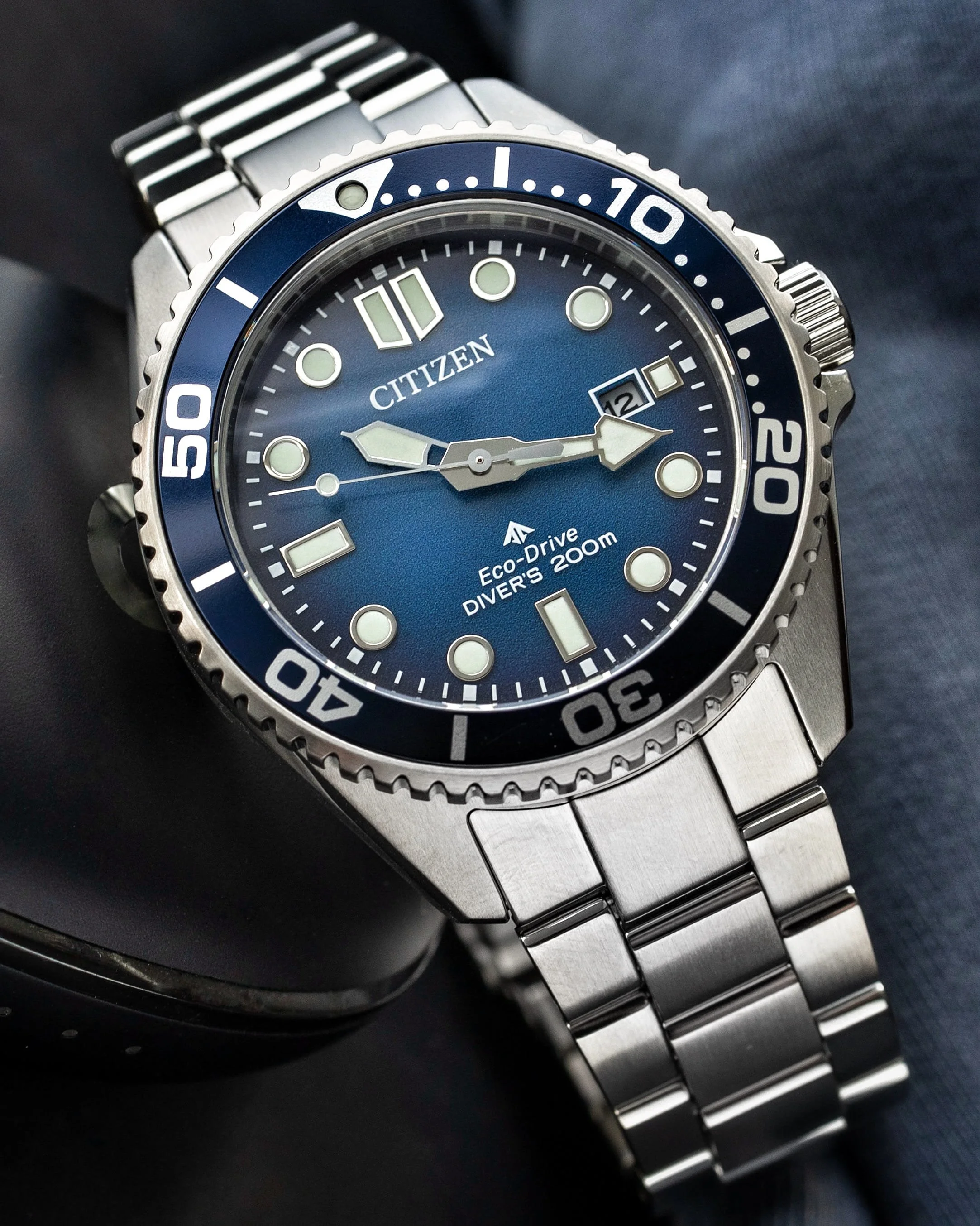 Citizen Promaster BN0260-54L with blue gradient dial, coin-edge bezel and stainless-steel bracelet.