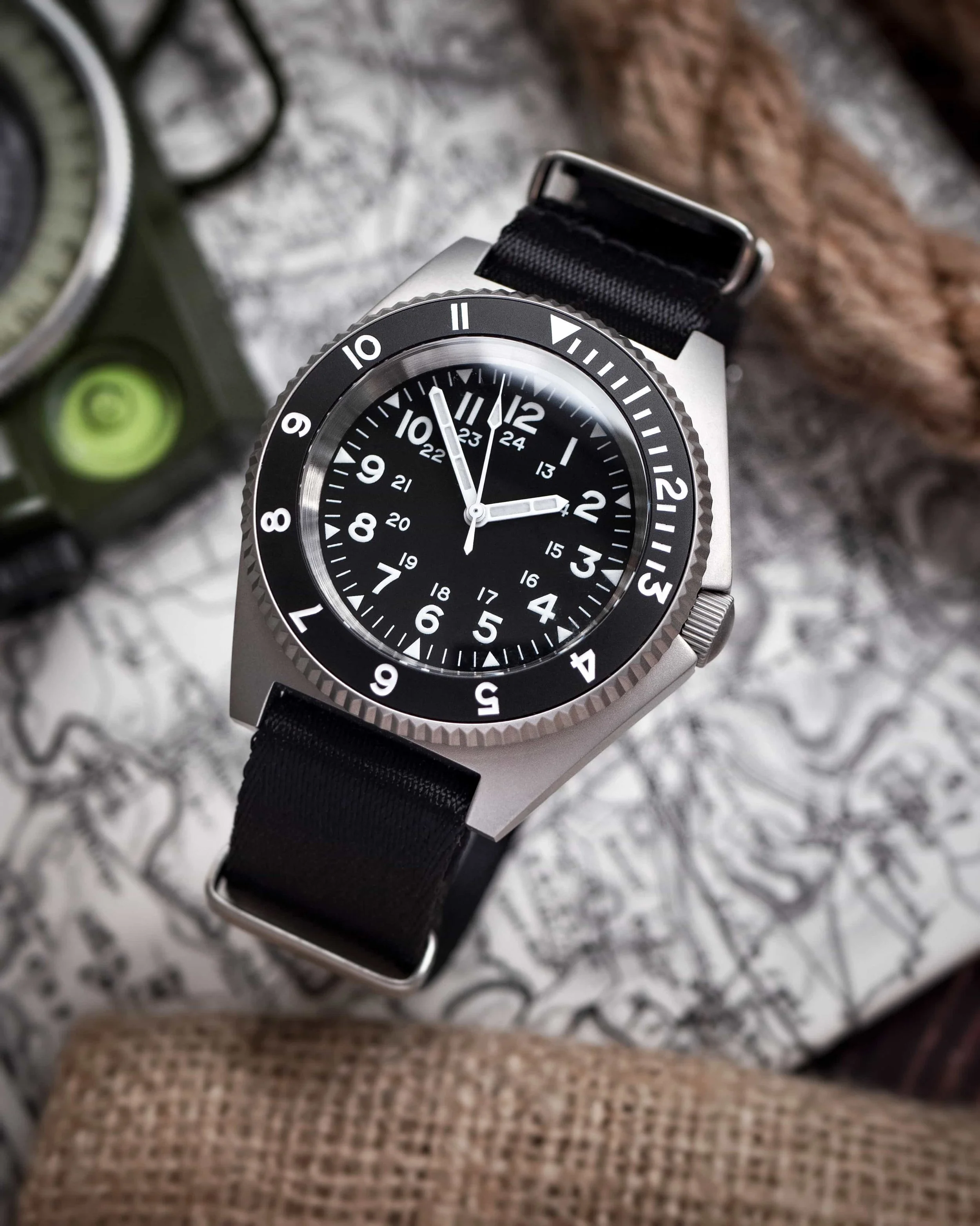 Angled view of the Namoki NMK20 showing its domed crystal and 12-hour bezel