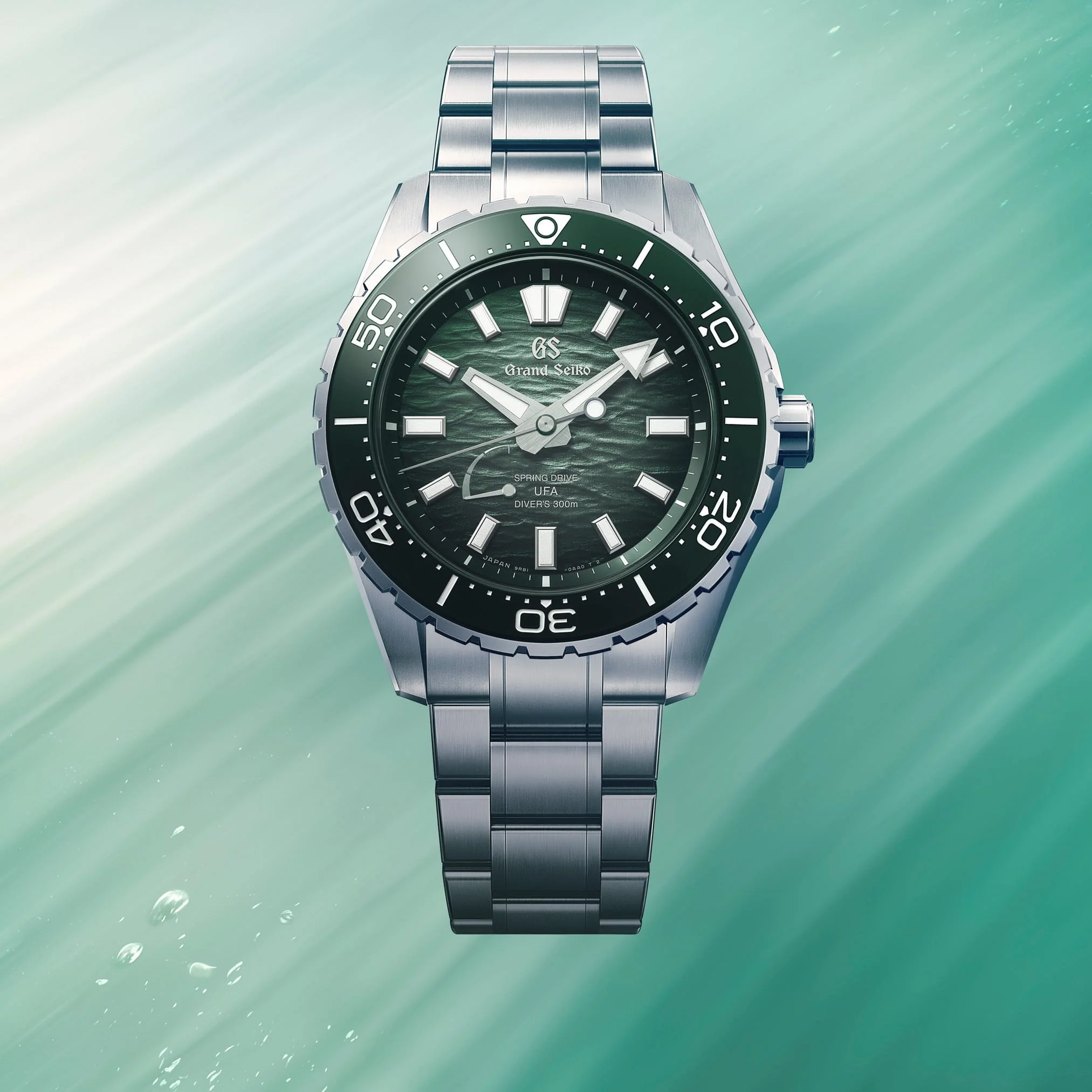 Grand Seiko SLGB025 Ushio 300 Diver with green textured dial, titanium bracelet and 300m diver design.