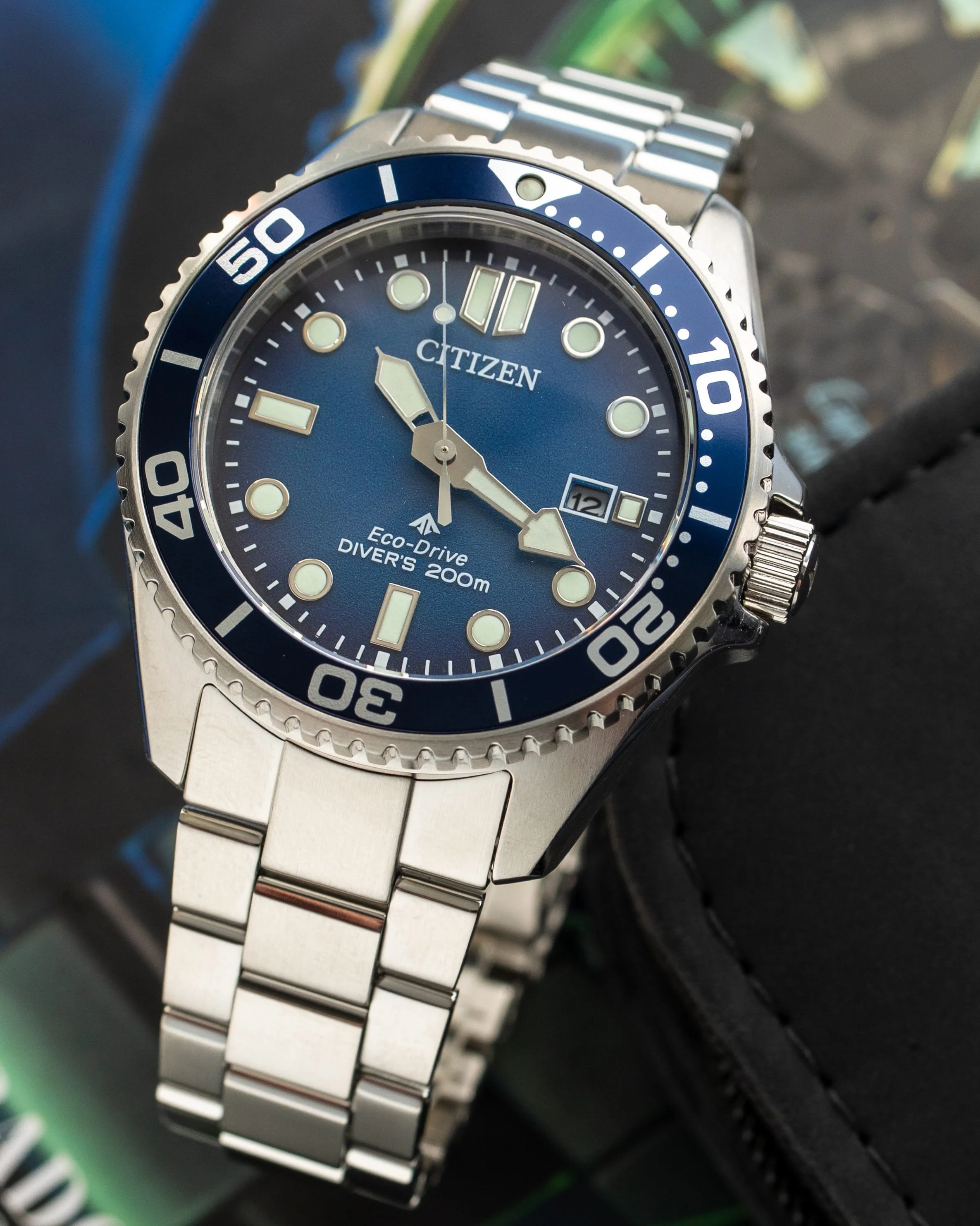 Close-up of the Citizen Promaster BN0260-54L showing the blue gradient dial, aluminium bezel and Eco-Drive branding.