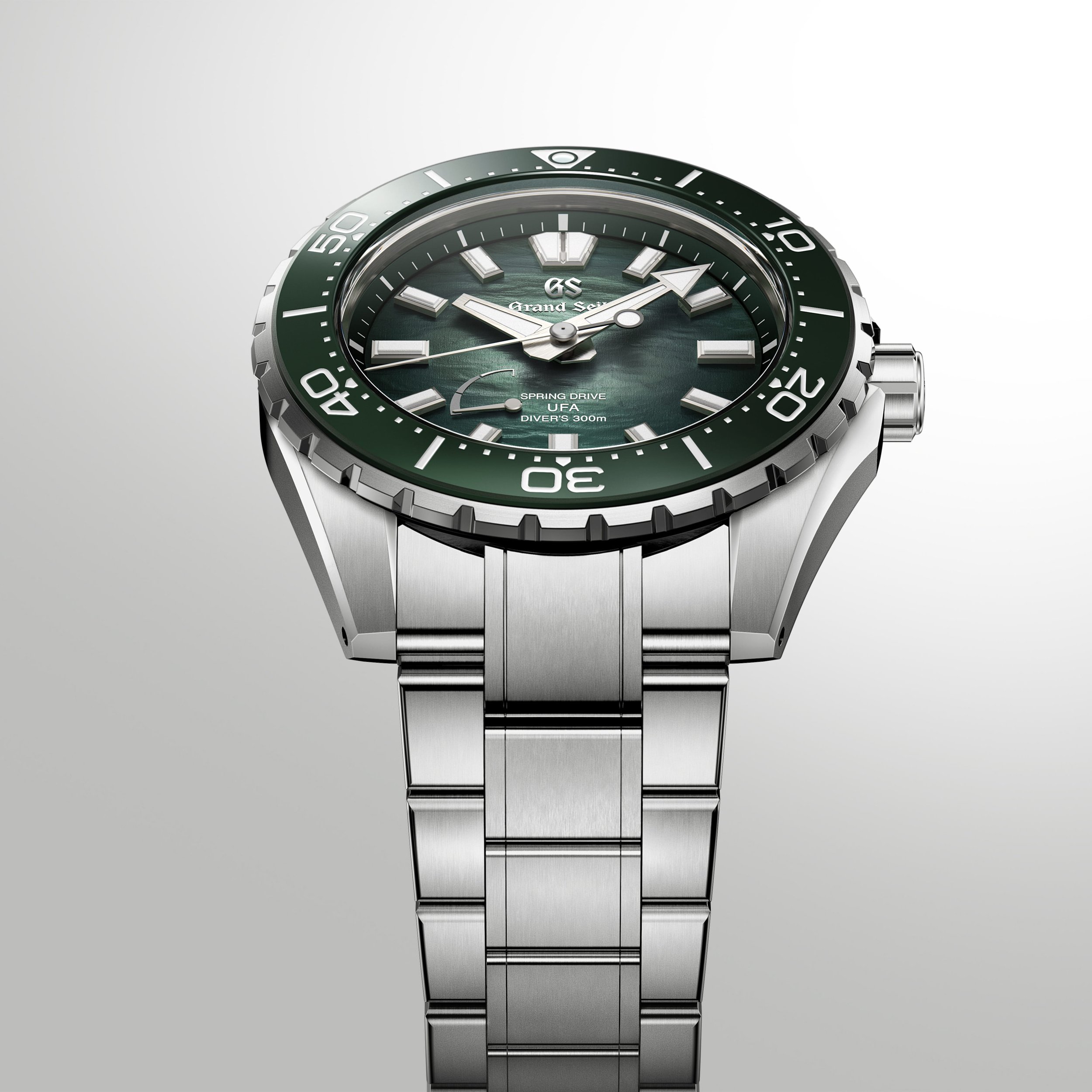 Grand Seiko SLGB025 Ushio 300 Diver showing the green textured dial, titanium bracelet and side profile.