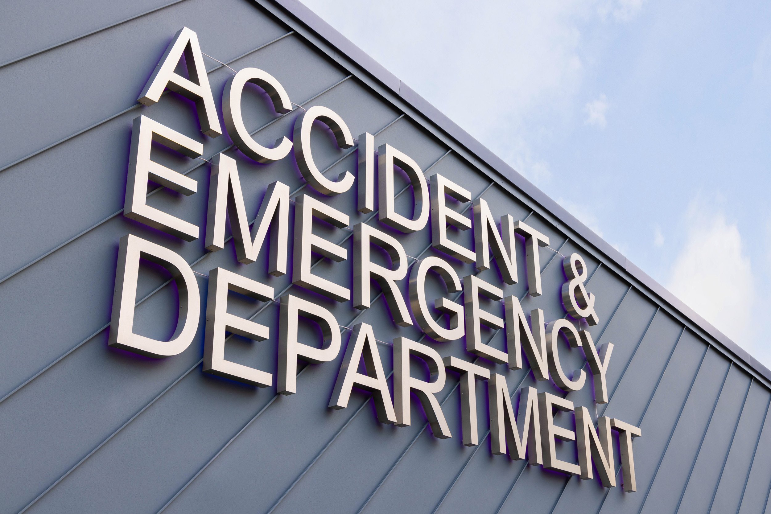 Sign for an Accident & Emergency department on building exterior.
