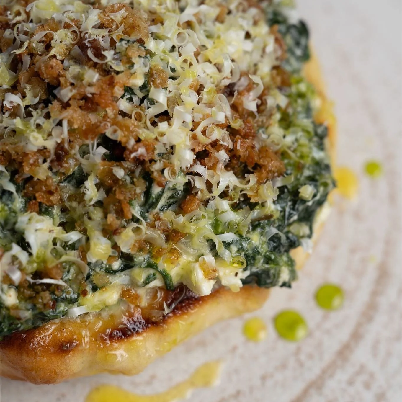 Spanakopita, on house made pita, the Yamas way! 

Garlicky, creamy, tasty deliciousness &amp; it&rsquo;s good for you! 🌱

Swipe to see how we do it 👉🏼