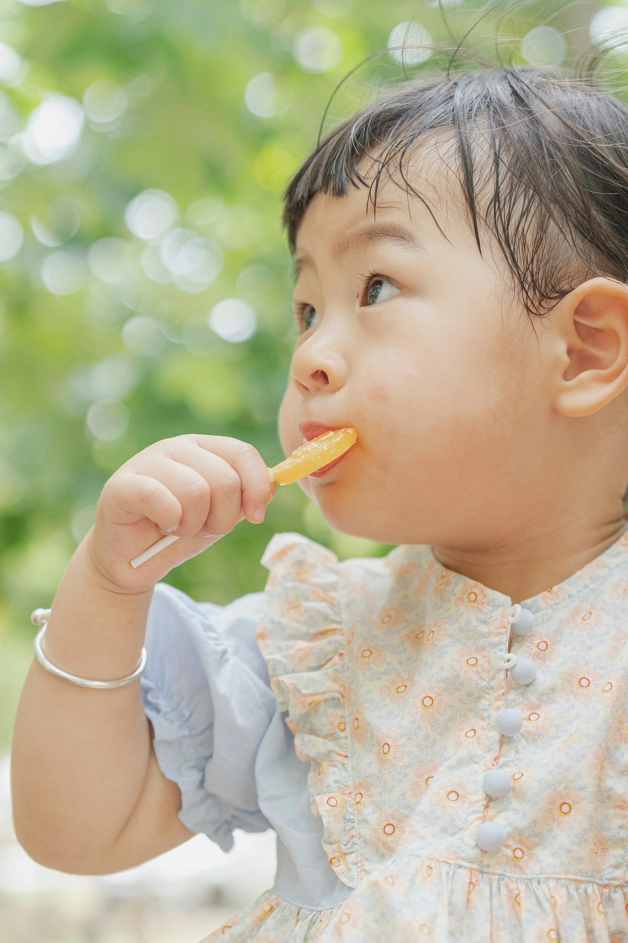 Baby with lollipop in mouth - evaluation for oral tie at ignite Kids