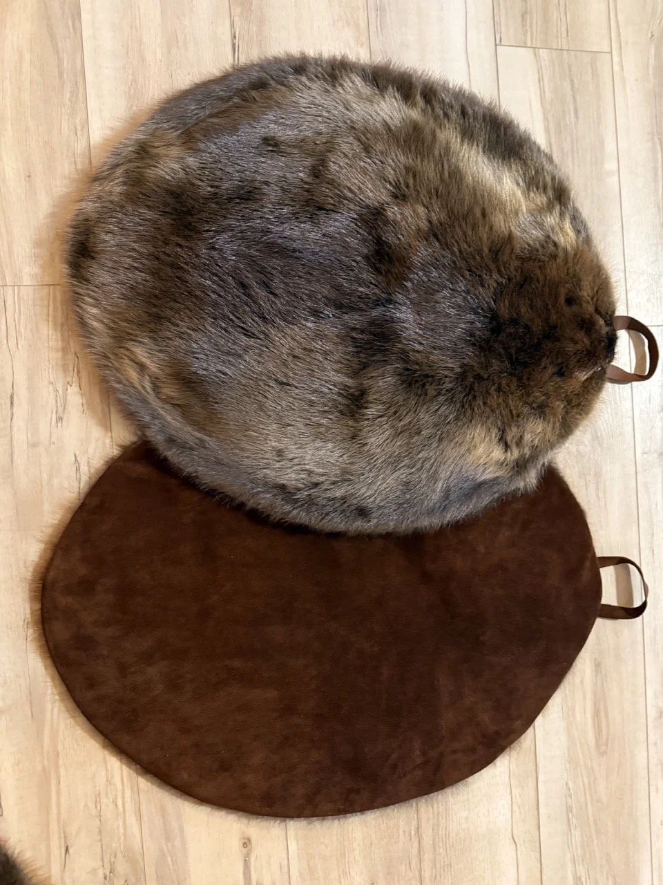 Beaver backed with bison leather and carry handle. Seat throws