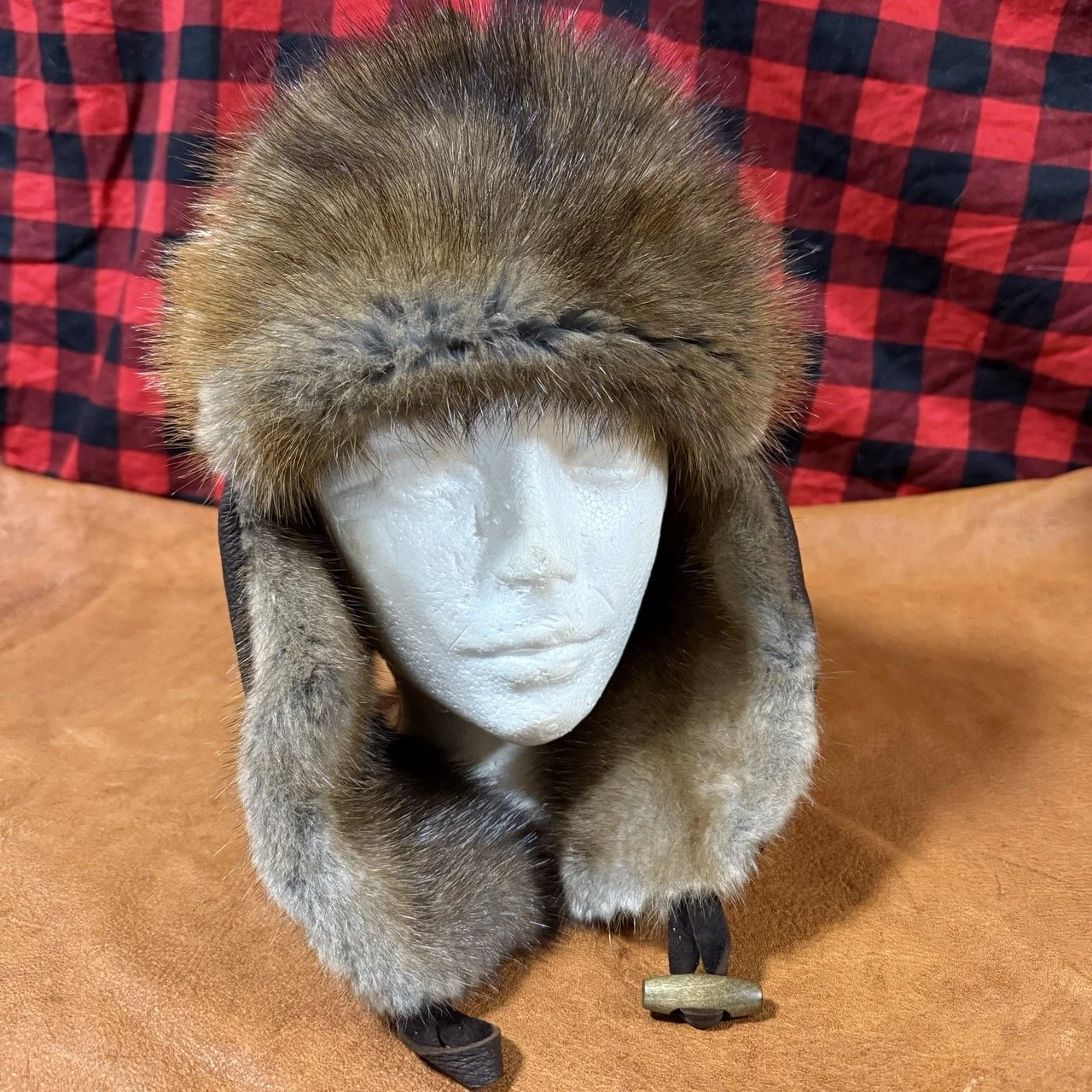 Dark brown bison leather, muskrat fur trapper hat