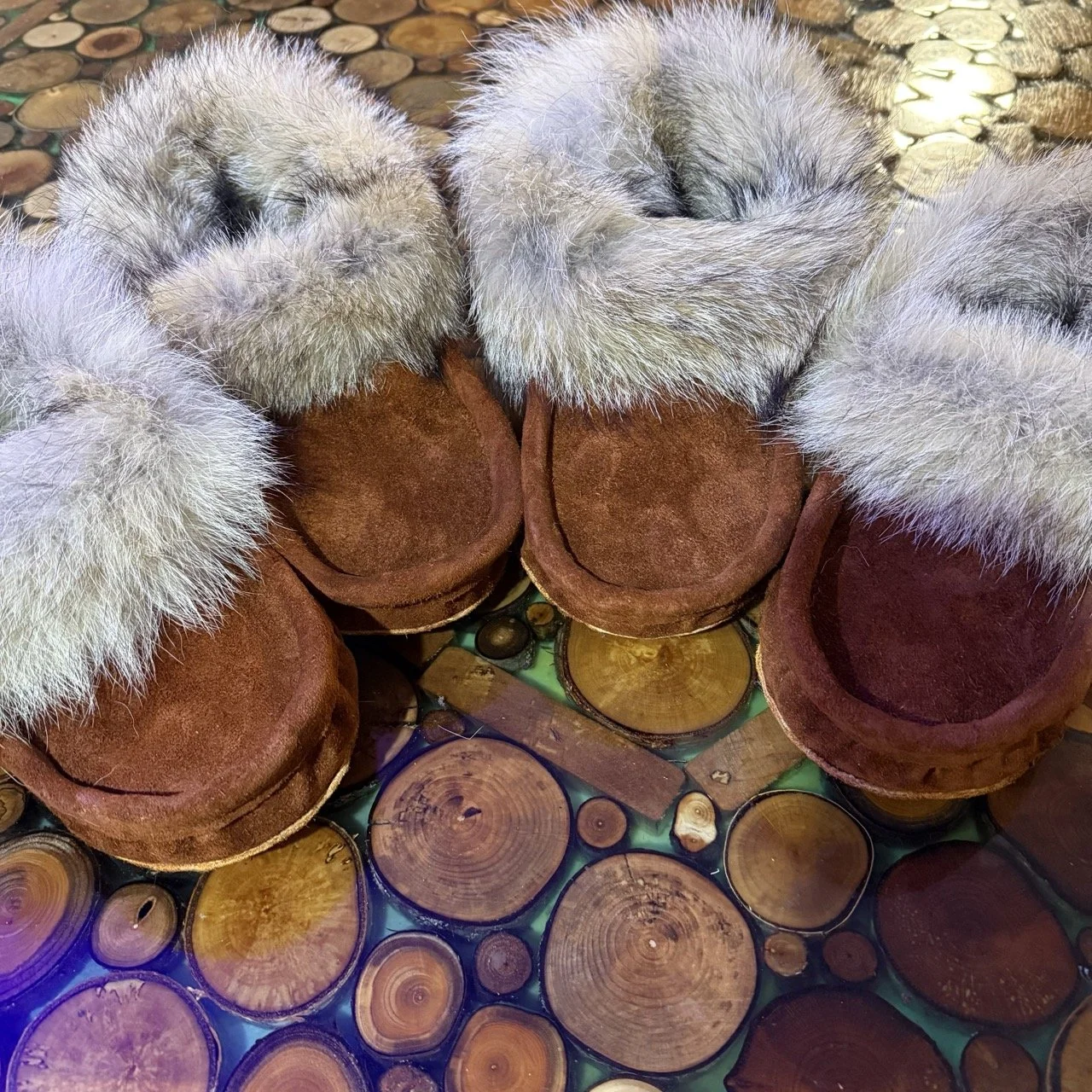 Winter moccasins, brown suede moosehide leather, sheepskin liner, coyote fur trim, leather sole