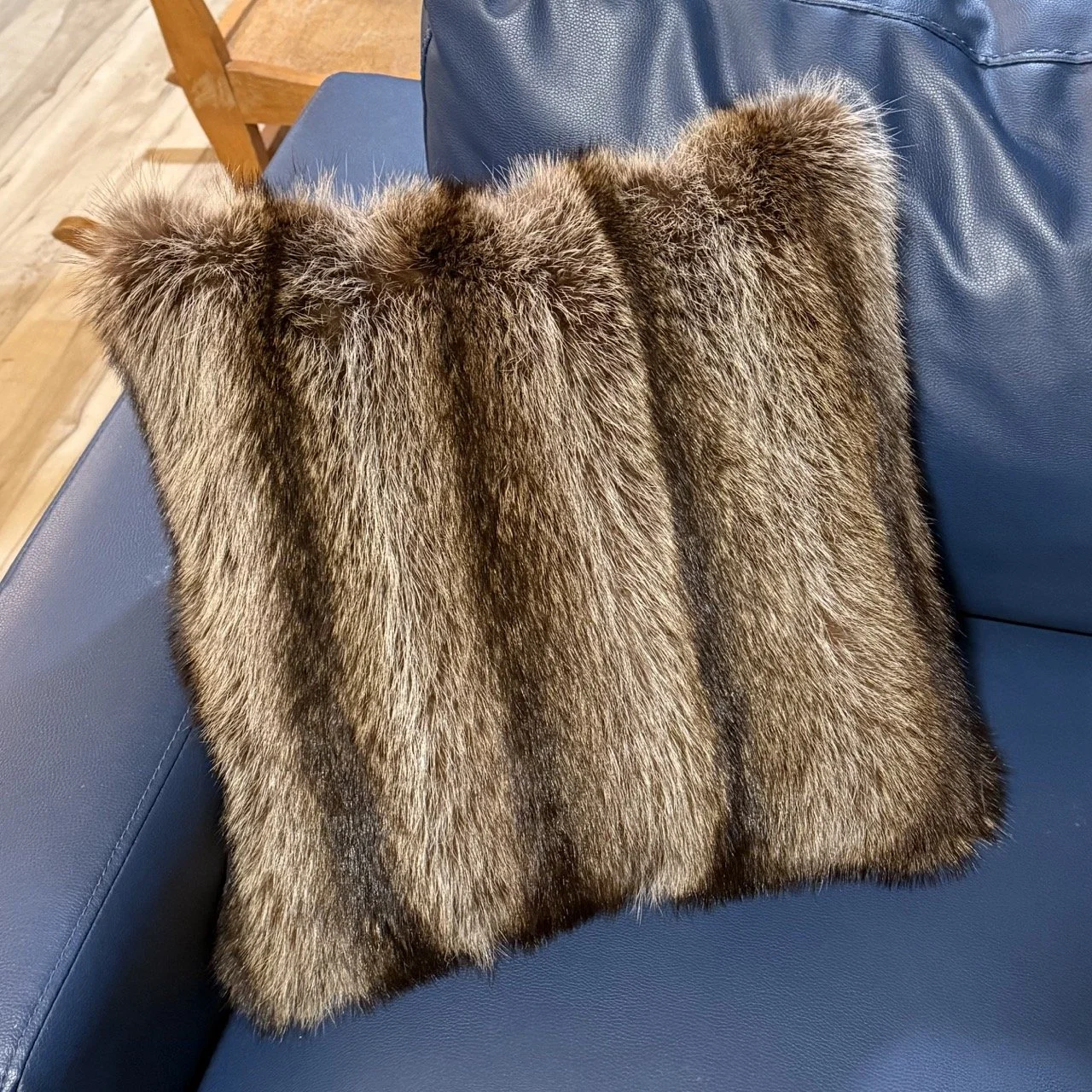 Raccoon pillow from repurposed raccoon coat