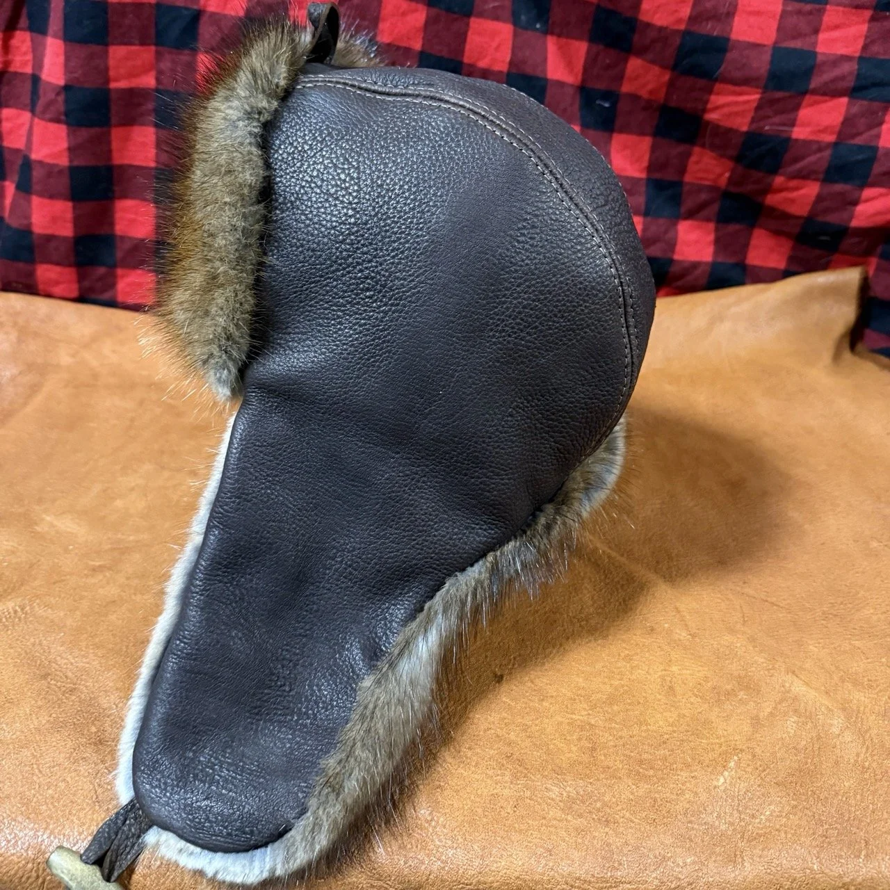 Dark brown bison leather, muskrat fur trapper hat