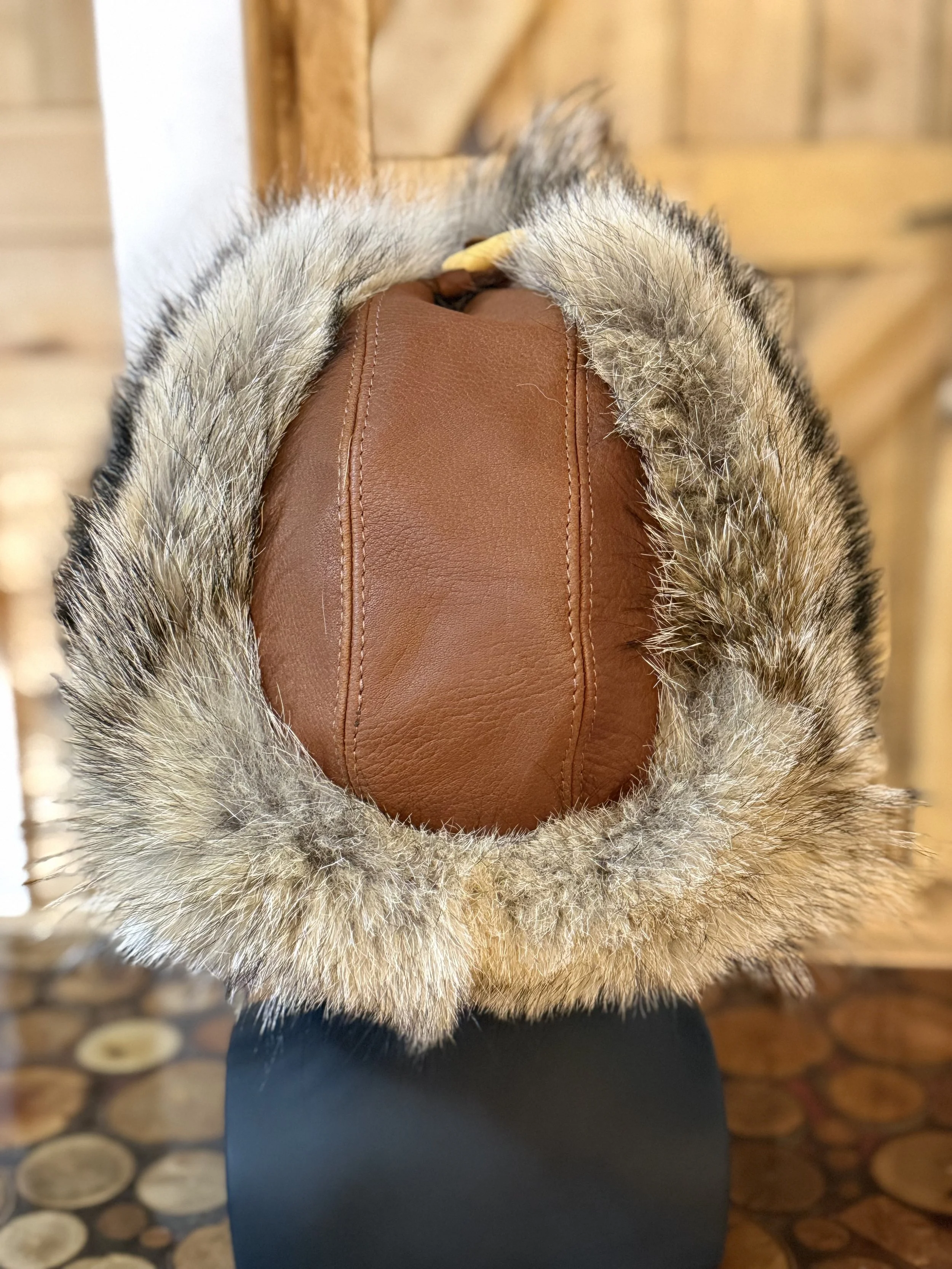 Coyote trapper hat, bison leather
