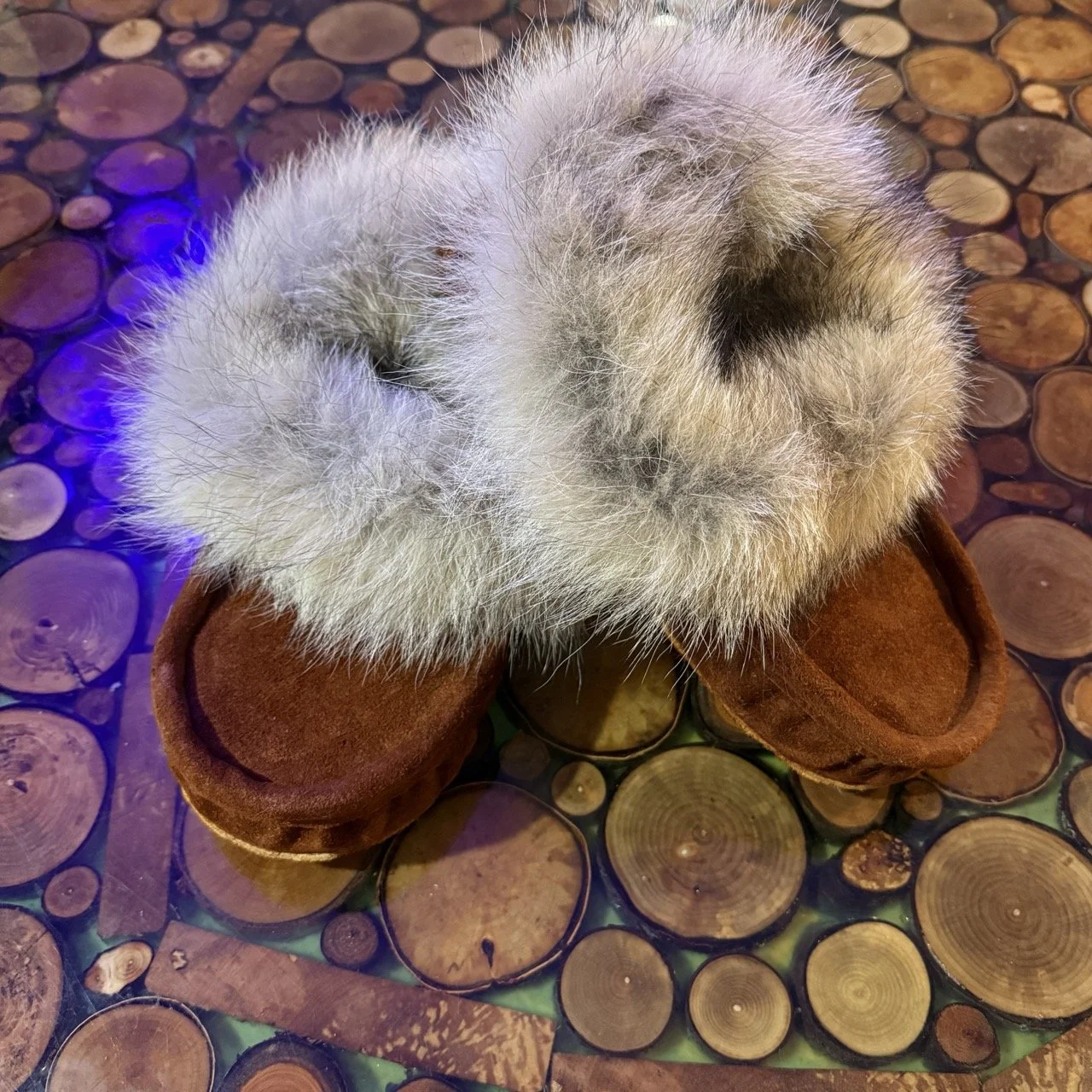Winter moccasins, brown suede moosehide, coyote fur trim, sheepskin lined, leather sole