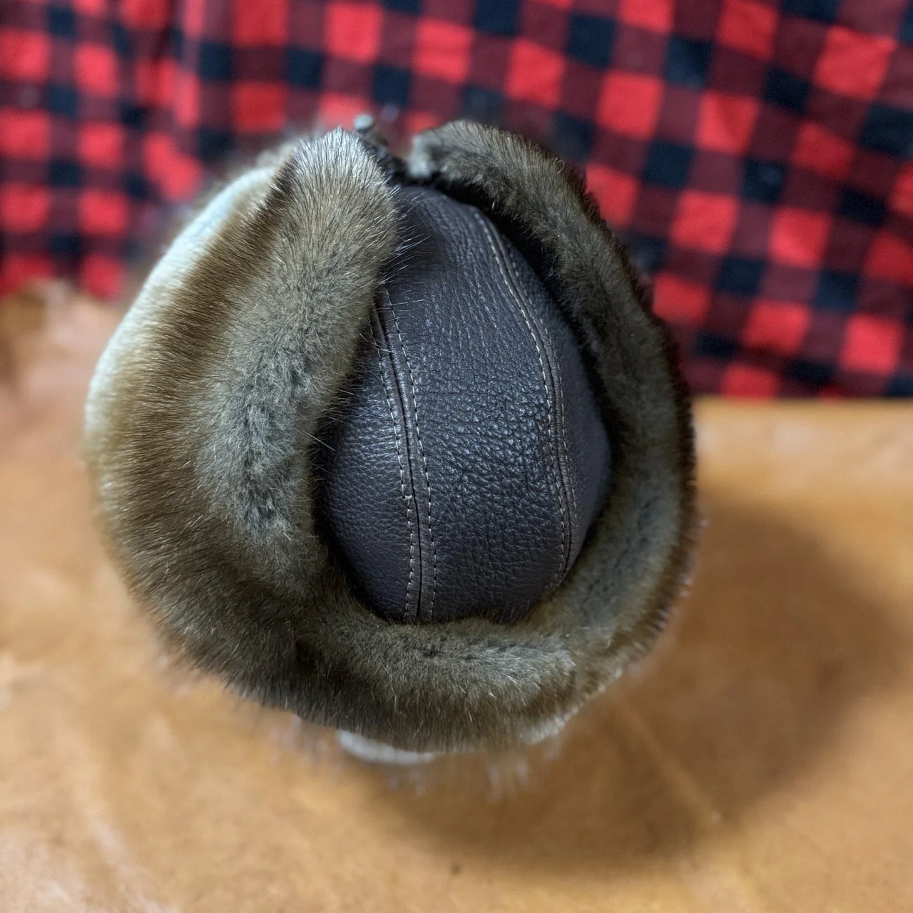 Dark brown bison leather, muskrat fur trapper hat