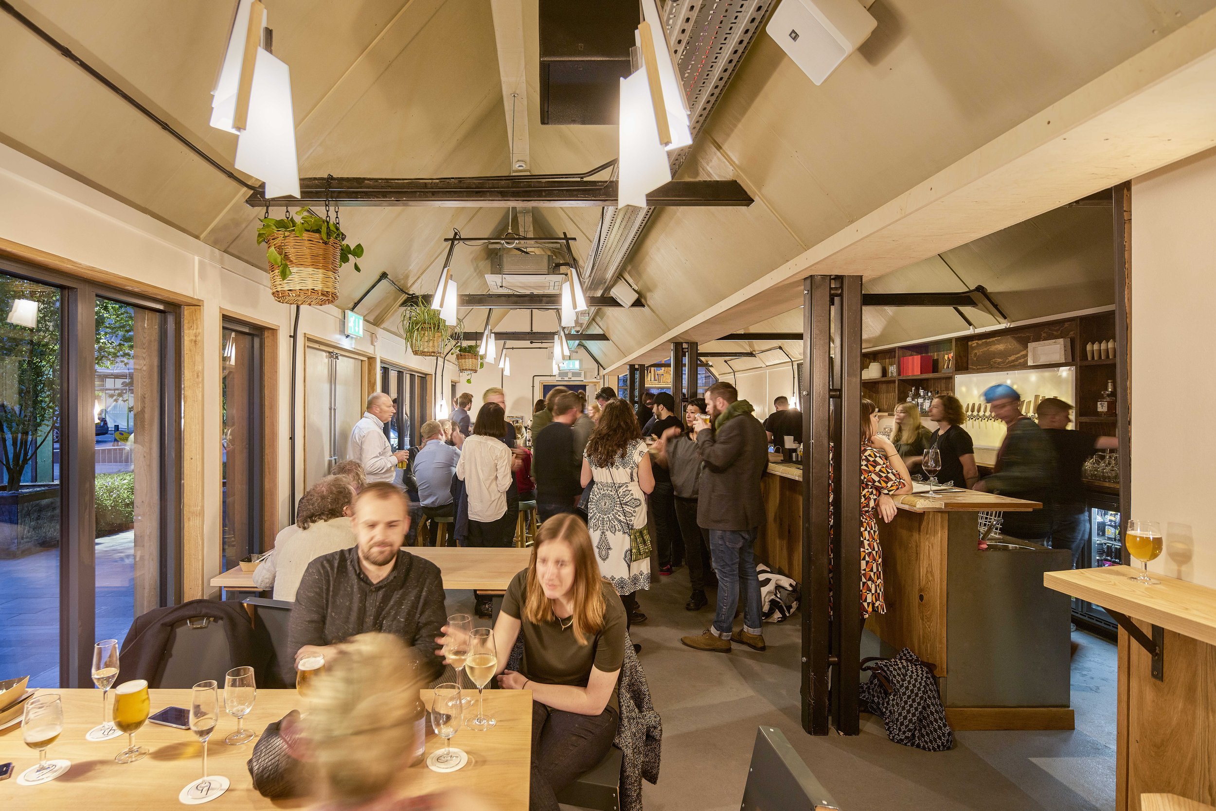 group of people inside in evening at Pilcrow project