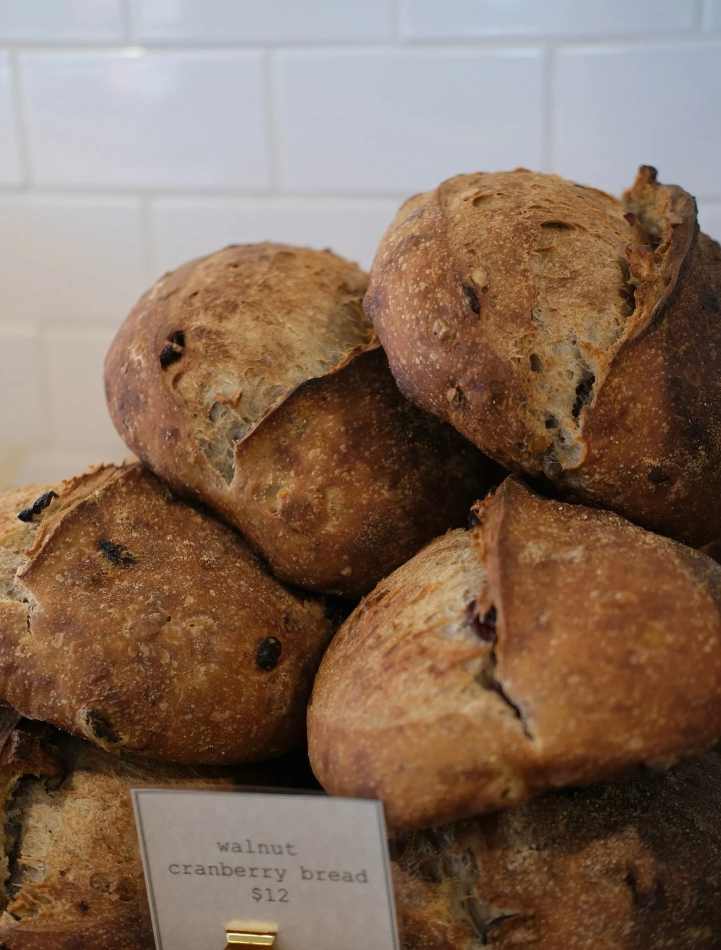 Originally on our Christmas Catering menu, this loaf is sticking around for the winter months! Folded with sweet, tangy cranberries and toasted walnuts, this sourdough loaf is a delight. We love it toasted with our house-made salted butter and a cup 