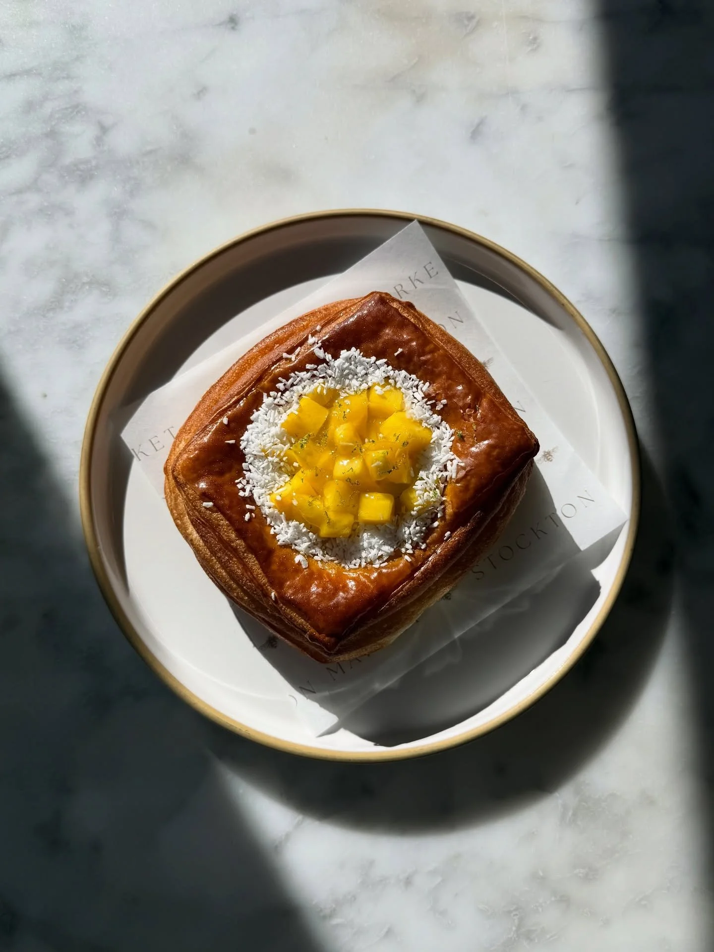 Gracing the bakery counter is our newest treat - Chef Guada&rsquo;s Mango Danish! 🥭🍋&zwj;🟩

Flaky croissant dough filled with coconut pastry cream, topped with fresh mango, grated coconut, and perfumed with lime zest. We&rsquo;re always inspired b