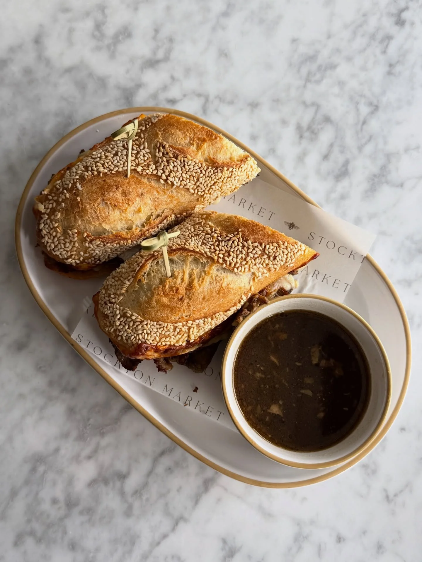French Dip Sandwich // top round beef, provolone, &amp; horseradish aioli on a seeded baguette, and of course aus jus for dipping (GFO &bull; NF)