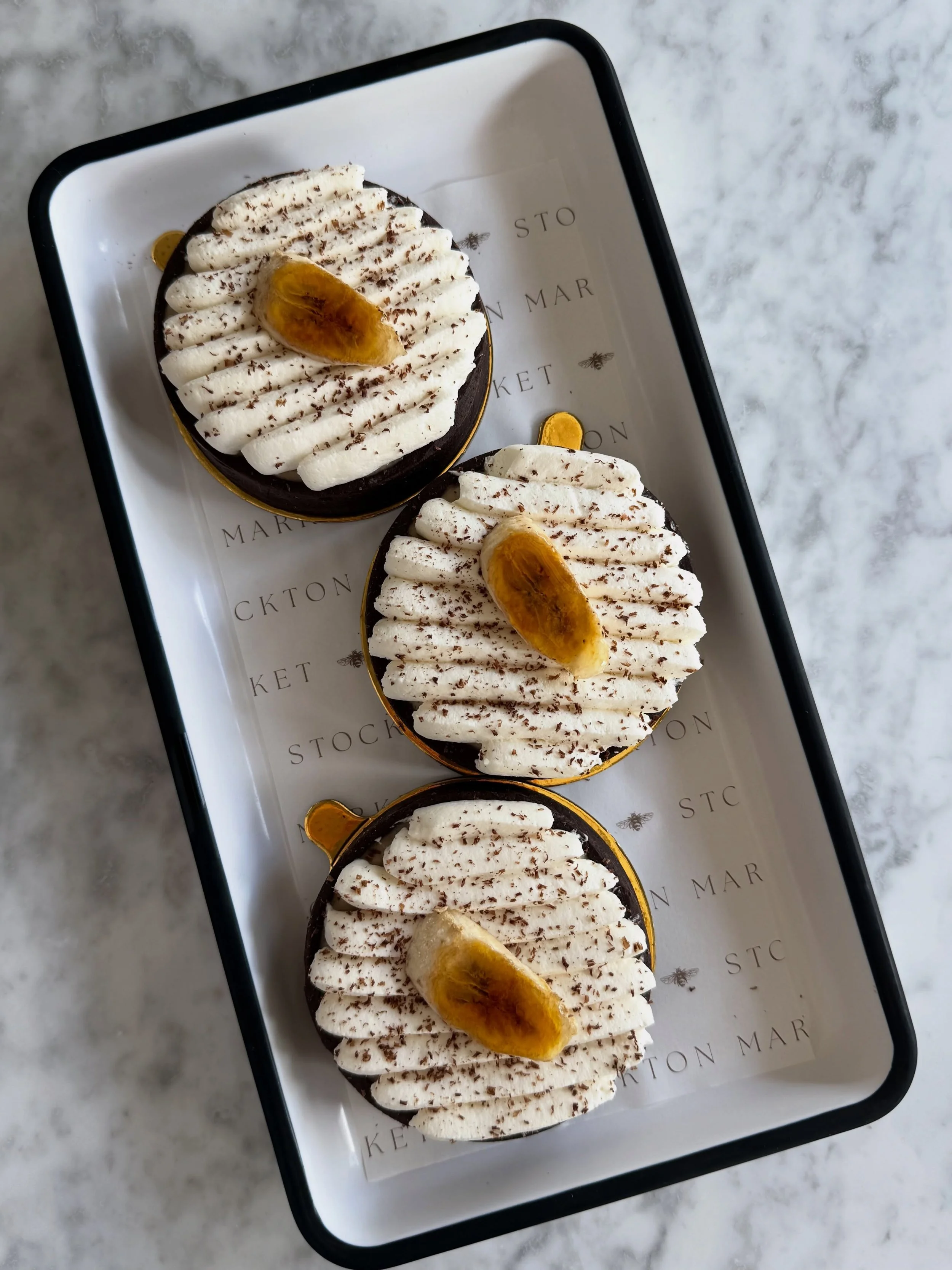 This sh*t is bananas! 

Slide 1 // Banana Caramel Tart: chocolate p&acirc;te sucr&eacute;e tart shell, salted caramel filling with sliced bananas &amp; banana pastry creme, topped with vanilla whipped cream, shaved chocolate, and a br&ucirc;l&eacute;