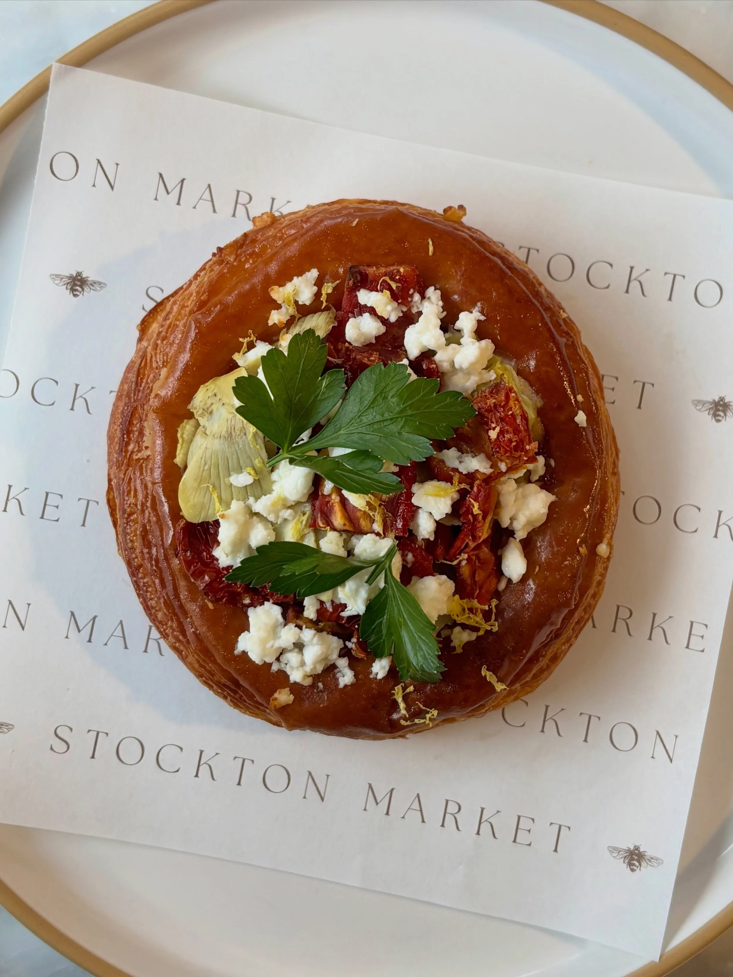 Formally introducing the two newest savory pastries to join our bakery counter! 🌱

Artichoke Danish // croissant dough. caramelized onions, bechamel sauce, artichoke hearts, sun-dried tomatoes, feta cheese, olive oil, topped with lemon zest &amp; fr