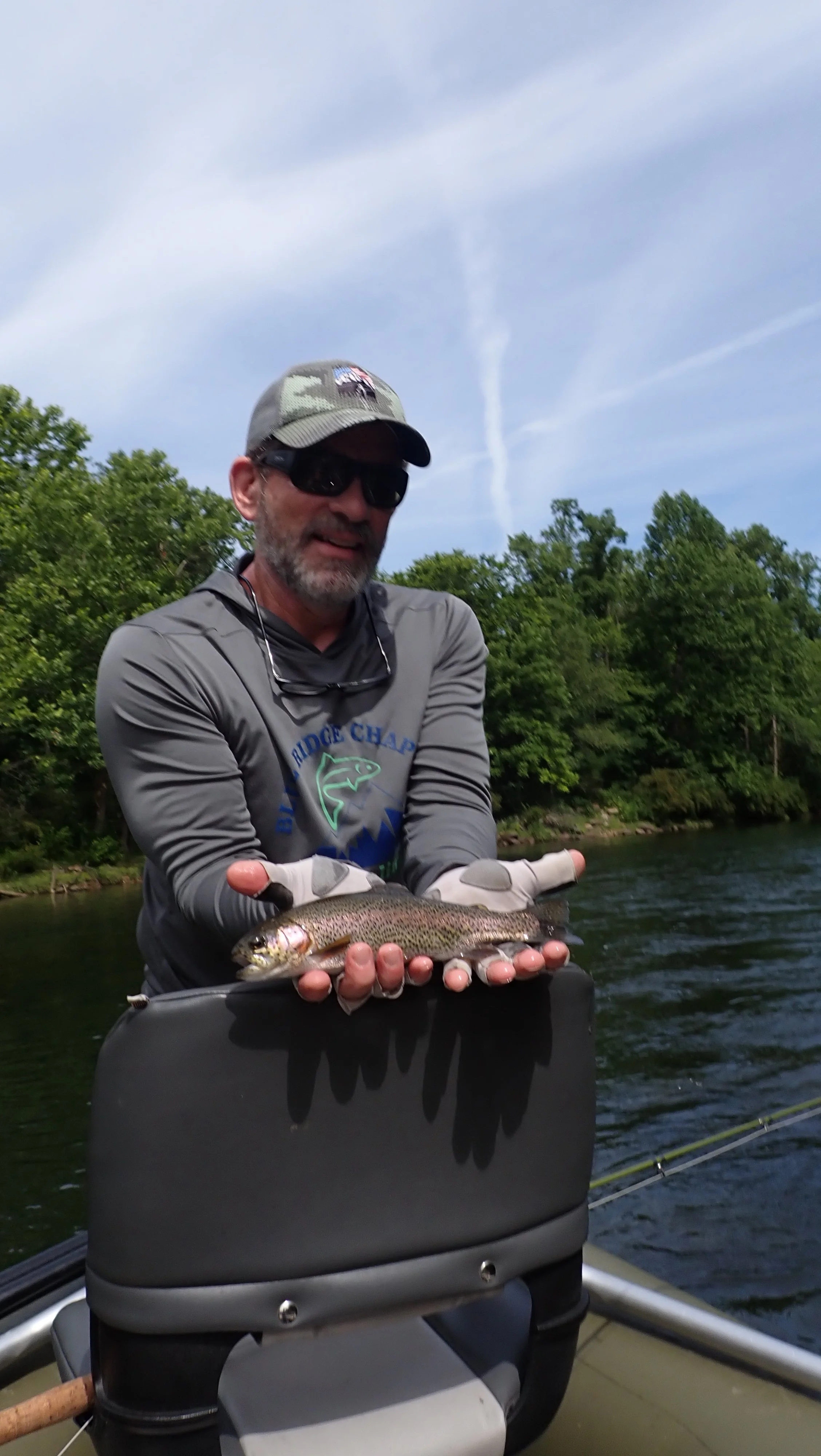 Troy with a rainbow he caught using a sulfur fly on the Watauga River with Weaver Fly Fishing.