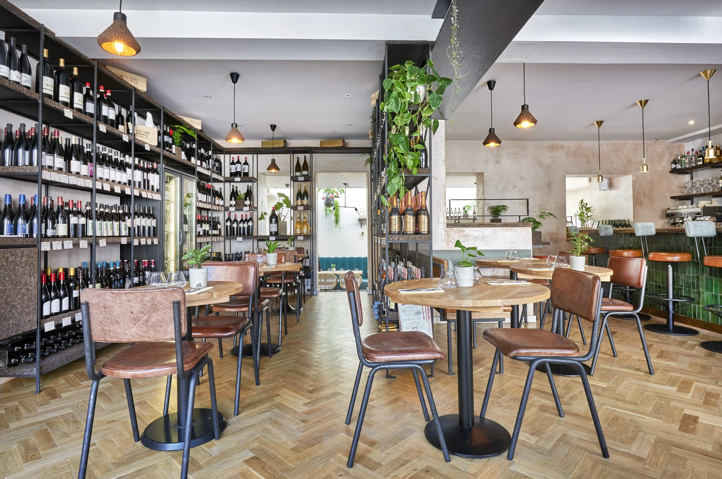 Wine shelving inside the Humble Grape Islington wine shop, bottles priced and labelled