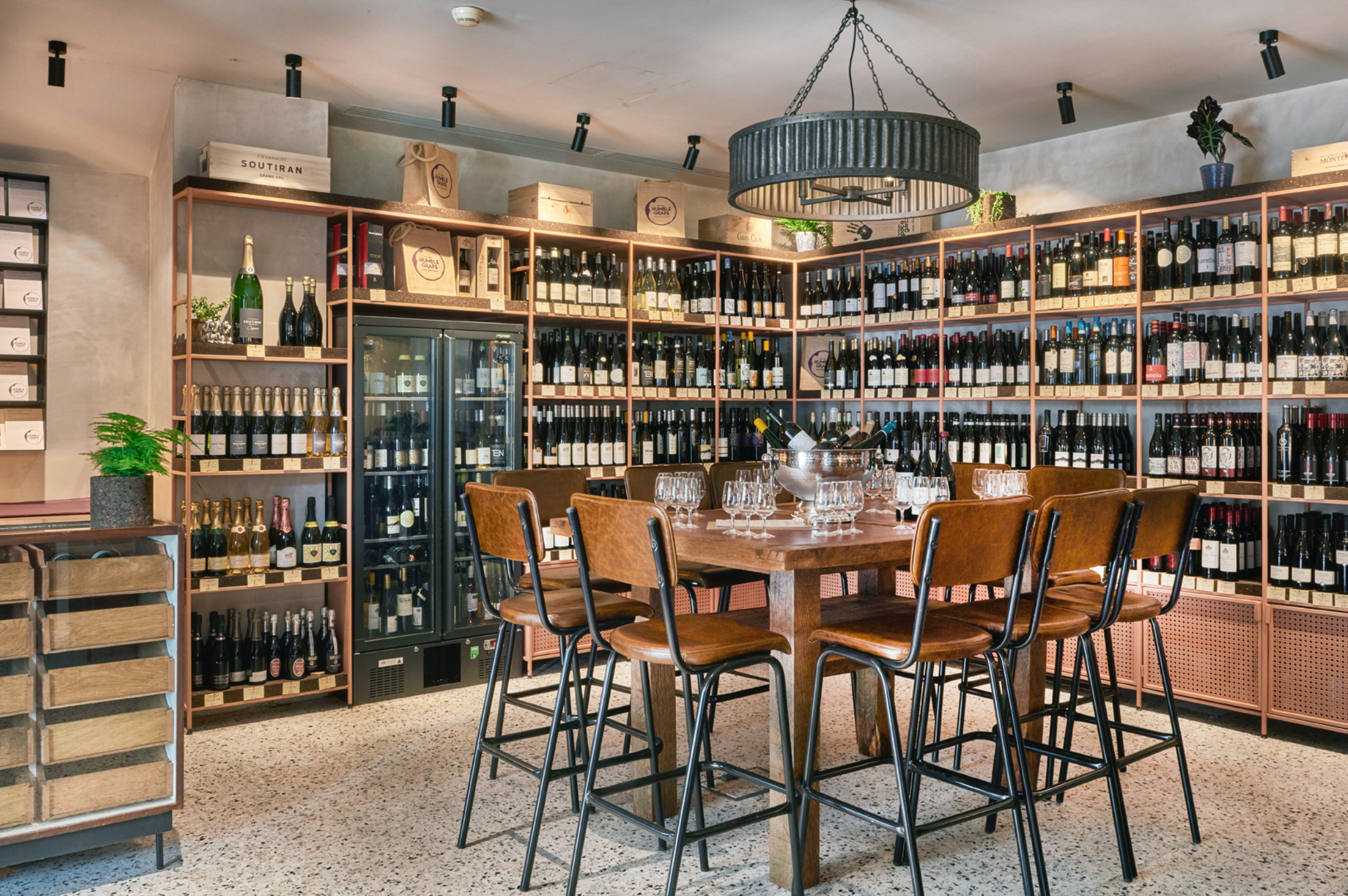 Wine bottles and glassware inside the Humble Grape Canary Wharf wine shop
