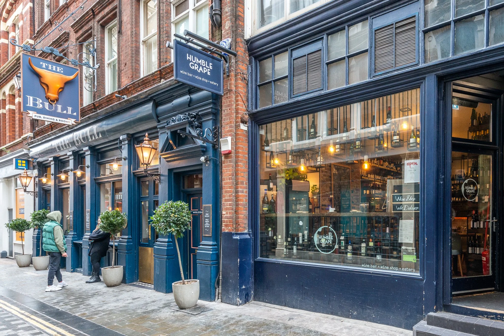 The exterior of Humble Grape Liverpool Street beside The Bull pub.