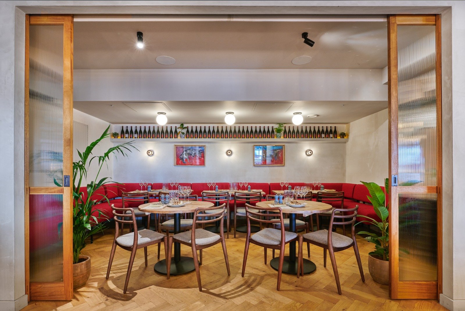 The Humble Grape Canary Wharf private dining room, seen through its double doors from the main floor