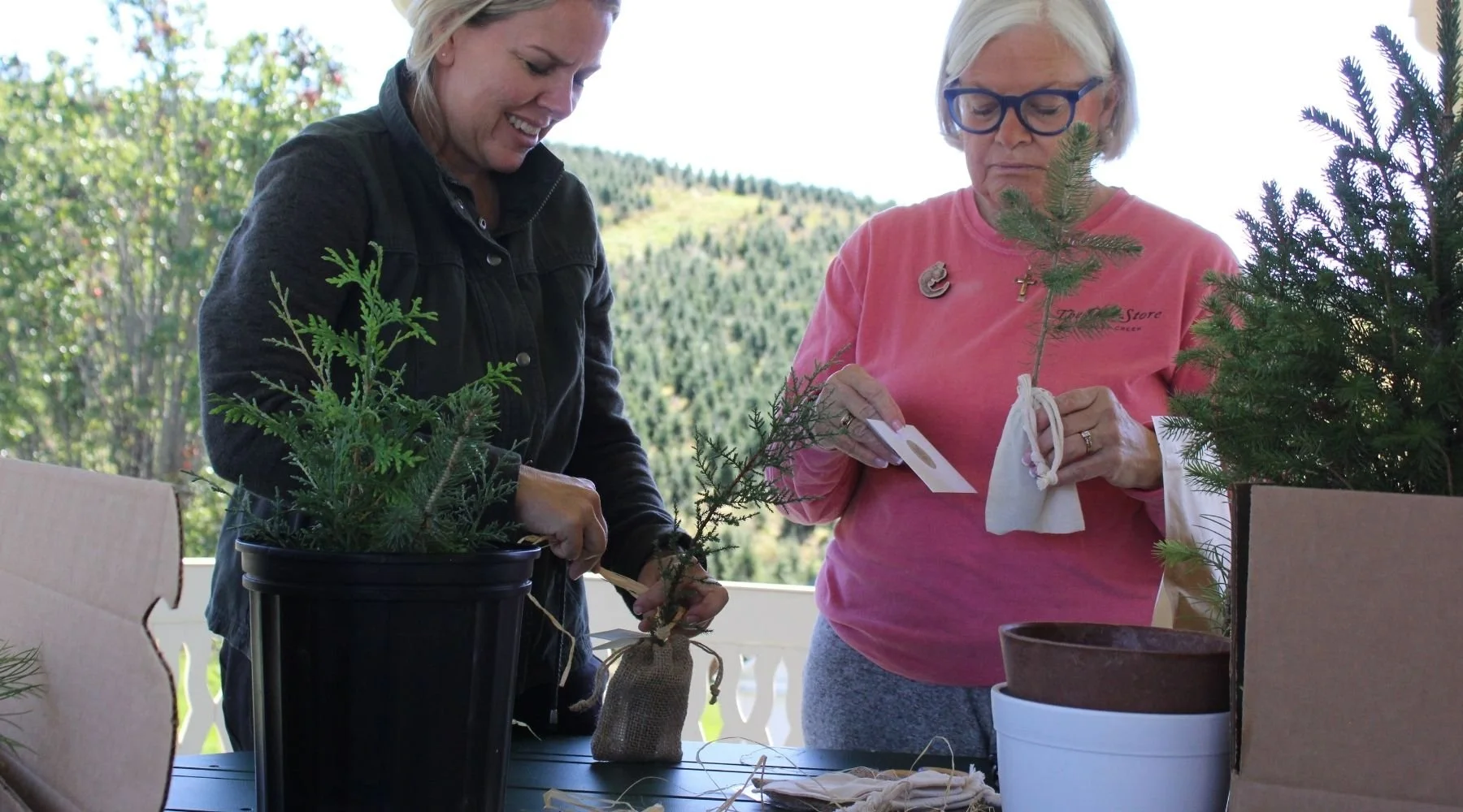 Little Saps founder Carrie McClain packaging Little Saps gift trees with her mother