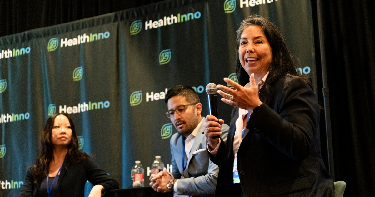 Dr. Gonzales speaking on stage at HealthAI 2025