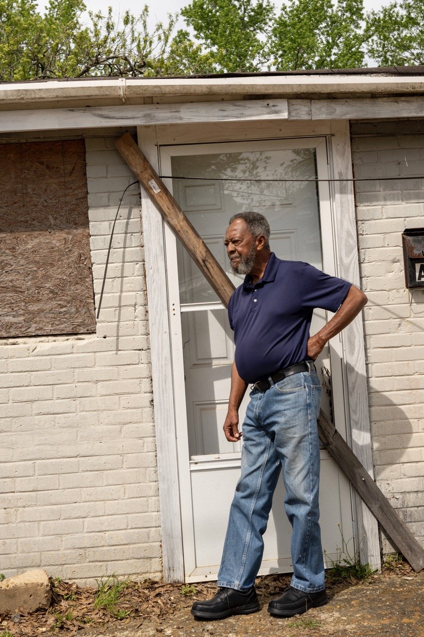  Bill Smith on Jones Street in Ruston, Louisiana, at the former site of Brown's Taxi stand. He leans against the building just as did in 1965 when he reportedly witnessed the police shooting of John Wesley Wilder. Credit: Ben Greenberg 