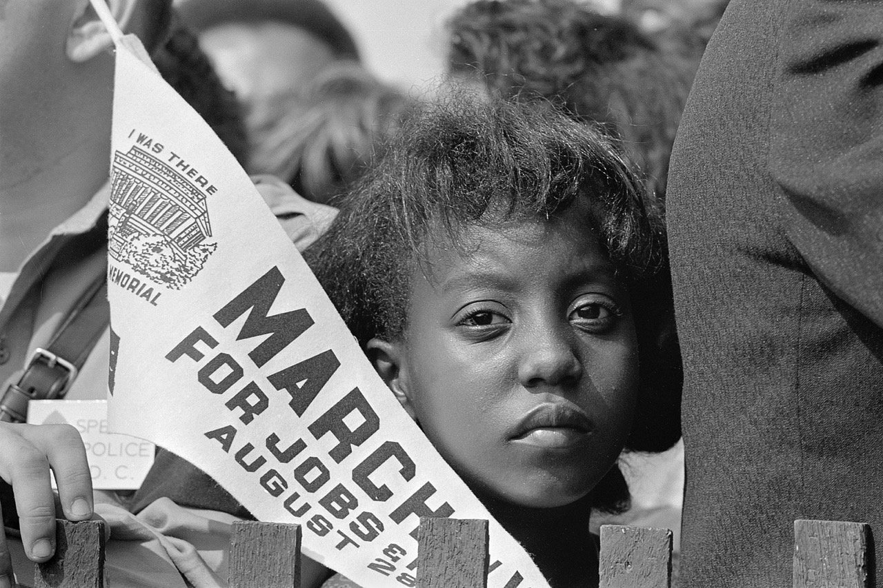  A Young Woman Holds a Banner at the Civil Rights March on Washington, D.C., on August 28, 1963. Credit: Rowland Scherman 